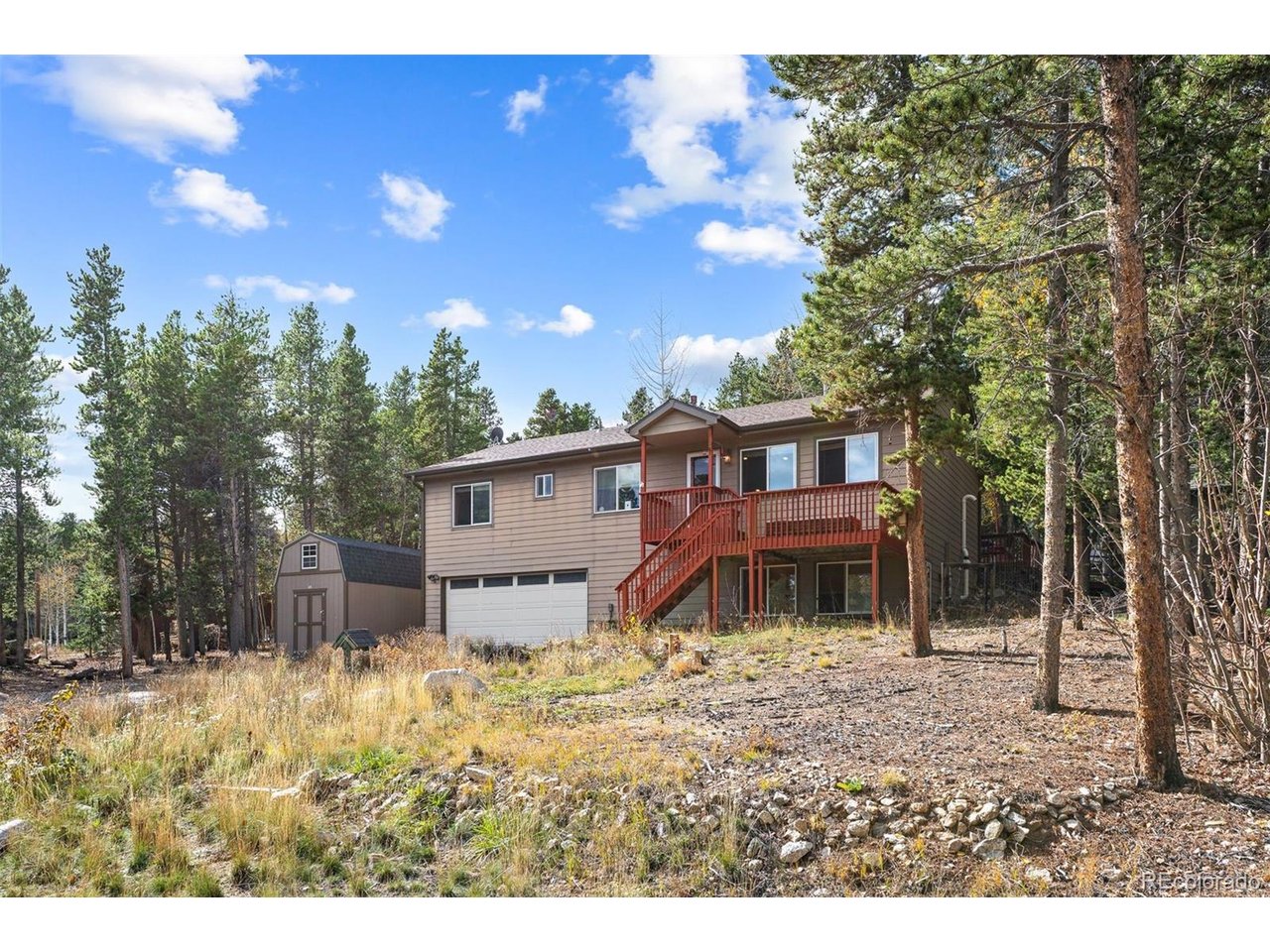 Tucked into the Foothills of the Rocky Mountains your Shire Awaits! Rustic mountain charm with natural landscaping surrounded by nature. Home is located within a very short distance of the heart of Black Hawk and Central City. Enjoy the open floor plan with mountain views tucked into a private setting. Hardwood floors, solid wood doors, custom wood trim work, natural stone accents, wood stove and main floor primary suite are just a few of the homes many details.  The vaulted ceilings allow for abundant natural light that sets the tone for your very own mountain paradise. Enjoy evenings relaxing and the sound of a  fire crackling in the wood stove. The kitchen is spacious with natural wood cabinets, stone accents, tile counters and stainless steel appliances.  The upper level has a secondary bedroom along with a home office/3rd bedroom. The finished lower level is currently being used as the primary suite. The lower level can be used as a recreation room, home gym, guest suite, workshop or craft room.  Take in the beauty of nature from your very own private backyard deck. Enjoy the daily wildlife sightings to include the moose and deer that love to visit! Imagine backyard social gatherings with friends and taking in the beauty of the Colorado Rocky Mountains! The 2 car  oversized garage provides plenty of space for vehicles and room for your Colorado outdoor sporting activities. Home is located just a short distance away from the Eldora Ski Resort and Nederland. Very easy access to HWY 119 for a commute to Boulder or the famous Gambling towns of Central City and Black Hawk. Multiple hiking and biking areas and public trails are just moments away! The Gilpin County Recreation Center and Library are just down the road a short distance. Multiple fine dining restaurants are located in the famous Gambling Towns of Central City and Black Hawk. Nederland is just a short distance away for shopping! Enjoy learning about the rich history of the local area! Welcome Home!