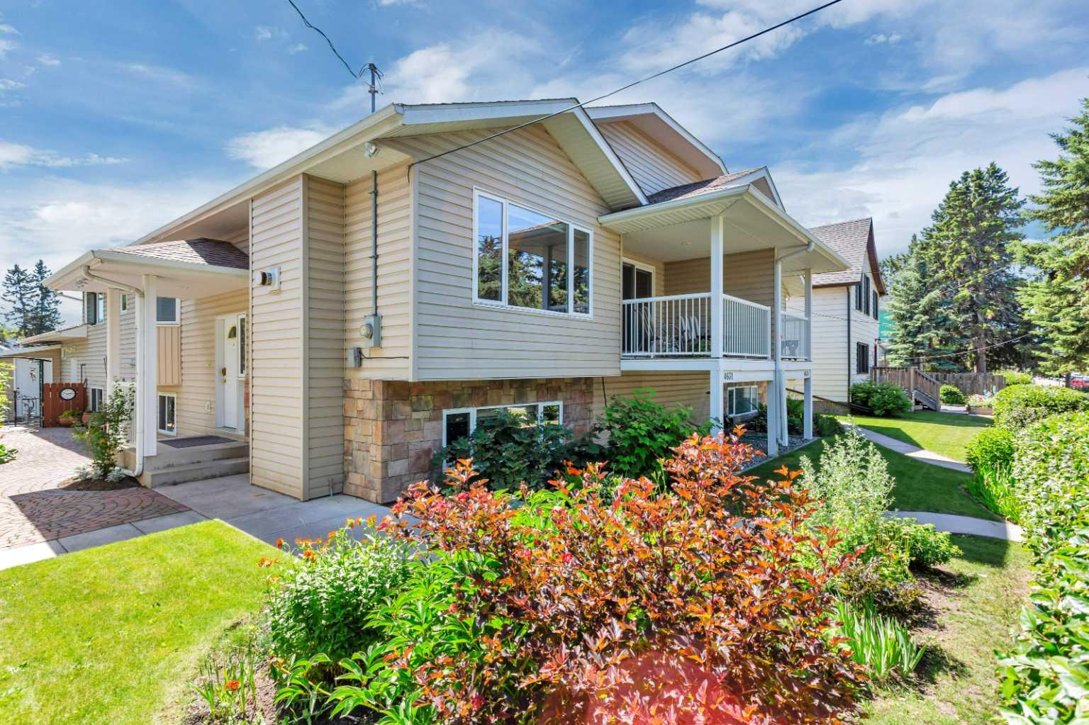 GREAT LOCATION |  DOUBLE ATTACHED REAR GARAGE | LOW-MAINTENANCE LIVING ~ This large and beautifully developed 3-bedroom + den, 3-bathroom bi-level offers space, flexibility, and added value in the desirable community of Parkvale. Curb appeal shines with mature landscaping and a covered front entry welcoming you inside. Hardwood flooring, vaulted ceilings, and large windows create an airy, open feel throughout the main level. The living room is centered by a cozy gas fireplace, while the adjacent dining room opens onto a covered front deck overlooking the tree-lined street. The kitchen features rich oak cabinetry, a walk-in corner pantry, stainless appliances, a large island, and a skylight for added natural light. A den just off the kitchen (with a closet) offers the potential to make a 4th bedroom or use as a home office. The spacious primary bedroom includes a walk-in closet with built-ins and a private 3-piece ensuite with walk-in shower. A 4-piece main bath includes an oversized vanity and jetted tub. Main floor laundry is conveniently located off the mudroom with direct access to the insulated, drywalled garage.

The fully finished basement features large windows, in-floor heat, and a versatile layout with 2 more bedrooms (one with an attached den), a family room, 4-piece bath, and a new kitchenette (note: not a legal suite). Outside, enjoy a mature backyard with perennials, shrubs, trees, a stone patio, and a storage shed. An extra-wide driveway provides plenty of off-street parking. Located just steps to parks, walking trails, schools, the Recreation Centre, and more—this is a rare opportunity in one of Red Deer’s most walkable and historic neighbourhoods!