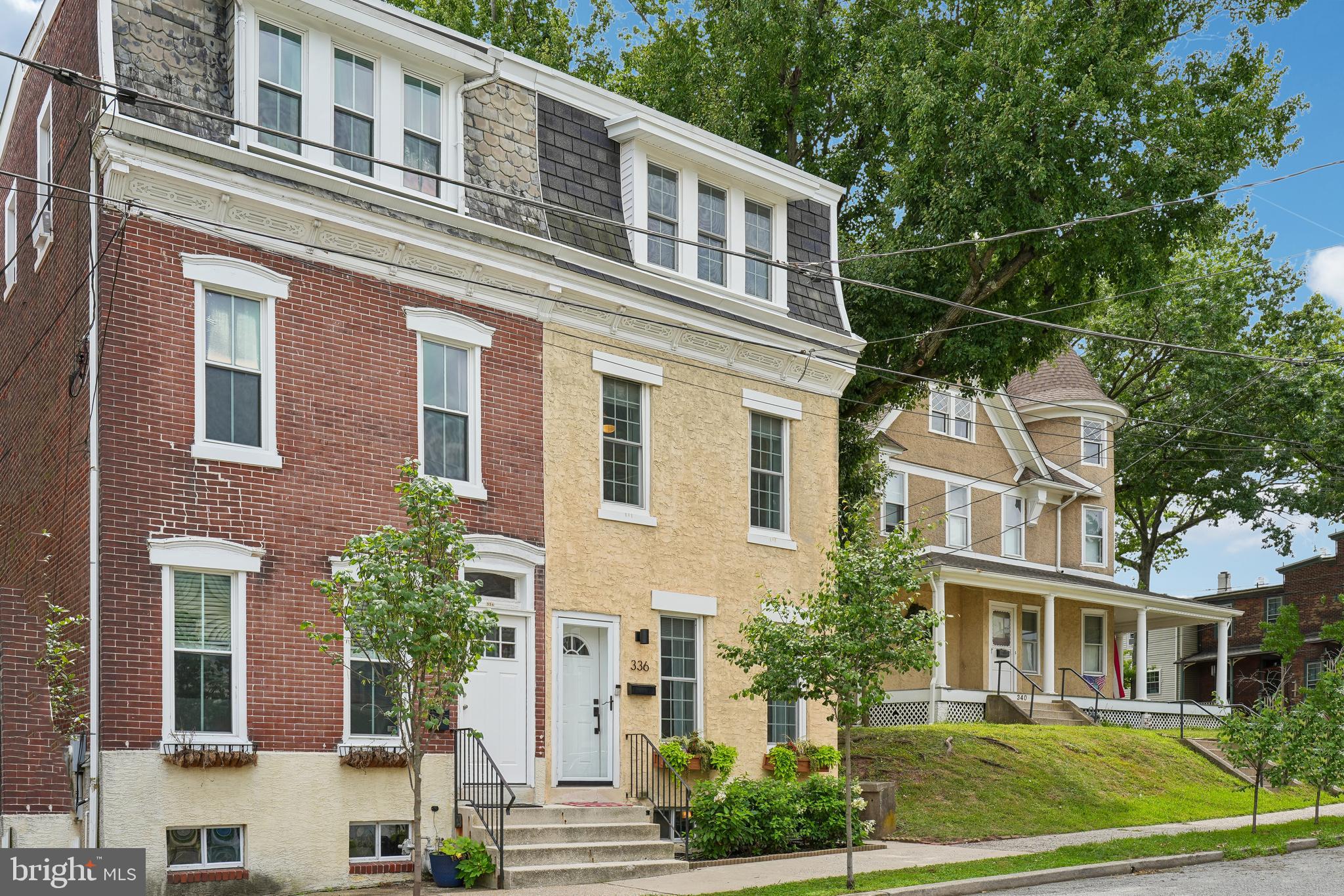 Some homes simply hold you the moment you walk through the door. 336 1st Avenue isn't just an address in the heart of Phoenixville; it is a canvas for your future memories, wrapped in the warmth and historic charm that makes this town so deeply loved.From the moment you step inside, you can already imagine quiet mornings with a cup of coffee and warm summer evenings watching the neighborhood go by. This is the kind of welcoming space that invites you to slow down, breathe a little easier, and feel an immediate sense of belonging in the sunlit living spaces. Beautiful, natural light pours through the windows, highlighting the rich character, elegant crown moulding, classic wainscoting and trim, and  hardwood floors that carry throughout the main level. Gather around the beautiful fireplace, which adds a perfect cozy focal point to the room.Moving into the heart of the home, the new kitchen has been thoughtfully updated and maintained to serve as the true gathering space of the house. Complete with sleek stainless steel appliances, a classic white subway tile backsplash, chic open shelving, and a gas stove, this space is designed for connection. Whether you are rolling out dough for holiday cookies or entertaining friends on a Friday night, it is an absolute delight.Head up the newly carpeted stairs to find restful retreats featuring four generous bedrooms that offer peaceful sanctuaries at the end of a long day. The upper levels shine with new luxury vinyl plank flooring on the second and third floors, complemented by new overhead lighting and ceiling fans throughout. The primary bedroom is enhanced by stylish custom barn doors, adding a perfect touch of character. You will also find two full, beautifully appointed bathrooms, including a full bath thoughtfully updated in 2023.Beyond the aesthetics, this home offers incredible peace of mind with substantial mechanical and structural updates. Enjoy the comfort of a 2-year-young HVAC system providing reliable central air. The exterior is exceptionally well-maintained with a solid roof featuring new fascia, soffits, and flashing, as well as a brand-new fence enclosing the backyard. Even the structural details have been thoughtfully addressed, including new basement stairs.Living at 336 1st Avenue means you aren't just buying a house—you are inheriting a vibrant community with unbeatable walkability and history. You can leave the car parked, as you are mere minutes from the pulsing energy of downtown Phoenixville. Immerse yourself in the local culture by spending your weekends strolling to Bridge Street for independent boutiques, award-winning breweries, the legendary Farmers' Market, and movie nights at the historic Colonial Theatre. For an outdoor connection, you will enjoy easy access to the Schuylkill River Trail for morning runs or sunset bike rides.There is a unique soul to this home that cannot be captured in photographs alone. It is in the light dancing on the walls at golden hour, and the undeniable feeling that you are finally home. Don’t miss your chance to write the next beautiful story at 336 1st Avenue. Schedule your private tour today.