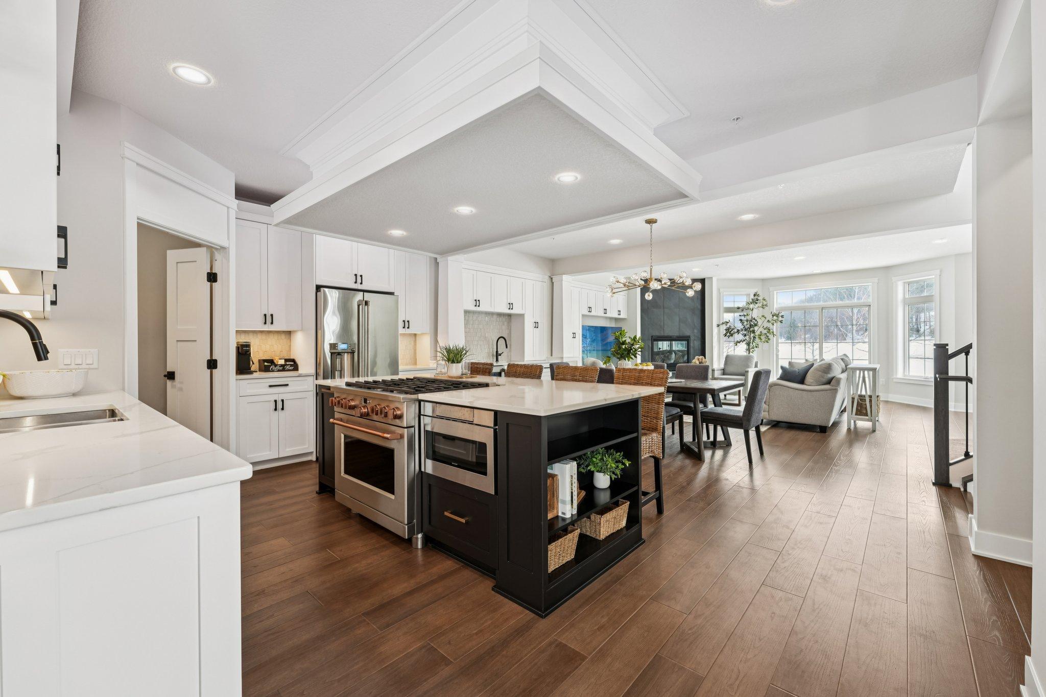 Welcome to the epitome of luxury living tailored for the discerning homeowner who values both elegance and practicality. Nestled in the heart of Woodbury, our newly built luxury townhomes redefine sophistication with every meticulously crafted detail. With elevators reaching every floor, accessibility seamlessly blends with opulence in our residences spanning over 3000 square feet. Whether you dream of a two or four-car garage, our homes accommodate your every need. High-end luxury finishes grace every corner, exuding timeless allure. Choose from multiple trim and door packages to personalize your sanctuary, each a testament to impeccable taste. Enhanced, modernized, and re-designed in comparison to existing townhomes, our new Dancing Waters Luxury Townhomes harmonize classic charm with contemporary comfort. Enjoy the convenience of a fantastic location near retail, restaurants, parks, and golf, with access to a community clubhouse for social gatherings and exercise. Elevate your lifestyle to unparalleled heights in our exclusive enclave, where luxury meets accessibility in perfect harmony. Experience the added appeal of a shortened new construction timeline.