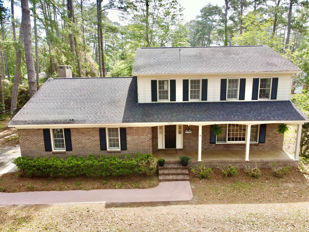 Welcome to what could be your Dream Home in Sherwood Forest, Thomasville, GA! Discover this hidden gem nestled in the highly sought-after Sherwood Forest neighborhood. Perfectly situated near Glen Arven Country Club and Archbold Hospital, this spacious 4-bedroom, 2.5-bath home offers comfort, convenience, and endless potential. Step inside to find beautiful hardwood floors—creating a warm and inviting atmosphere. The cozy wood-burning fireplace is perfect for relaxing evenings, while the versatile bonus room currently set up as a downstairs bedroom, offers endless possibilities for your lifestyle needs. Retreat to the expansive master suite, featuring a double walk-in closet with his and her sides, plus a charming sitting room for your private relaxation. Enjoy outdoor living with an approximately 20 x 40 concrete pool (new filter, cleaned and ready to swim in), complete with an adjoining covered changing area and half bath—ideal for entertaining family and friends. Bring your vision and make this house a true showplace once again. Don't miss your chance to own a piece of Sherwood Forest's charm!