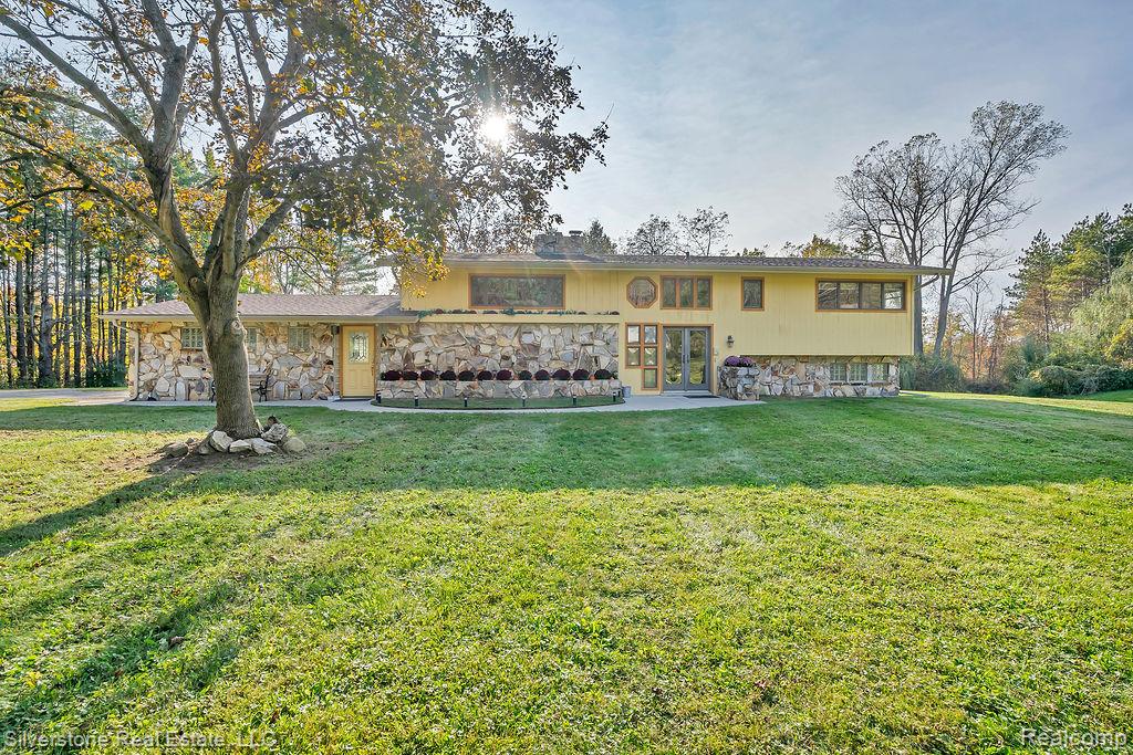 This serene 4-bedroom, 2.5-bath home is perfectly positioned on over 20 acres of breathtaking, partially wooded land—offering the ultimate blend of privacy, recreation, and opportunity. Recent improvements include a newer roof, a new master bedroom picture window, construction upgrades, fresh paint, and brand-new flooring and trim throughout—making this home move-in ready with modern updates already complete. Inside, you’ll find two inviting fireplaces that create warmth and charm, perfect for cozy Michigan evenings. Large windows showcase the peaceful surroundings, where deer and turkey are frequent visitors. The property features an impressive 645 feet of golf course frontage on Castle Creek Golf Course, and the expansive acreage is splittable, offering outstanding potential for future development, investment, or additional building opportunities. A stocked pond adds to the appeal and is best enjoyed from the newer back deck—ideal for morning coffee or sunset relaxation. For entertaining, the cement-floor pavilion provides a dreamy outdoor gathering space, perfect for hosting family and friends. A true standout feature is the massive 7,200 sq. ft. pole barn—fully insulated and heated with 400-amp service. With potential to be rezoned for commercial use, this space opens the door to endless possibilities for business owners, hobbyists, or collectors. This exceptional property delivers the best of both worlds: peaceful seclusion surrounded by nature, yet convenient access to nearby amenities.