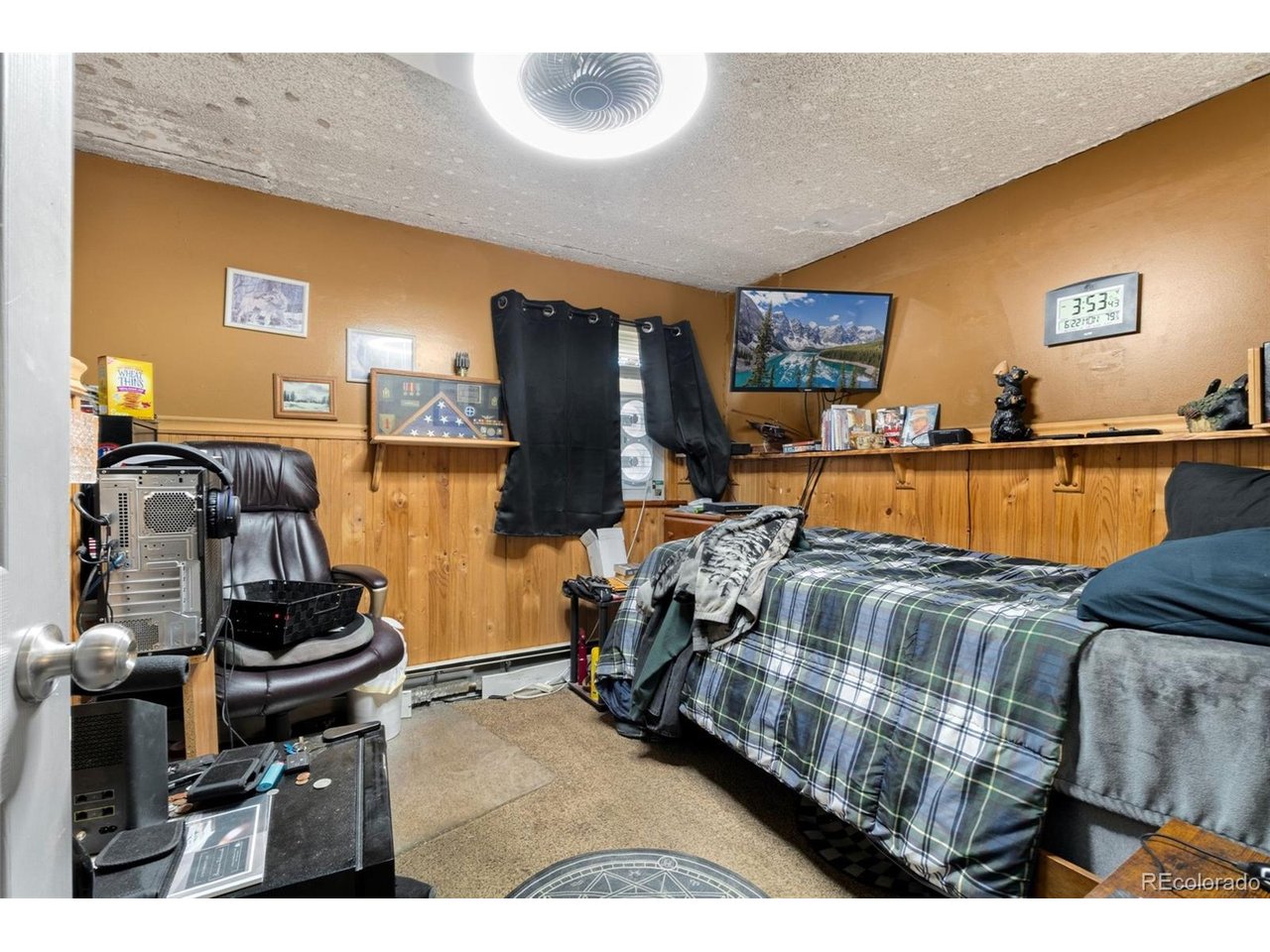 Big lot. Big potential. Set on an impressive 14,175-square-foot corner lot with no HOA, this Derby property offers something that's becoming harder to find-room to spread out. Plant the garden you've always wanted, host backyard barbecues, create space for pets to roam, or finally have room for projects and hobbies that need extra elbow room. A house can be updated over time, but a lot like this is something you simply can't recreate.The main level offers 1,260 square feet of living space with a functional layout that feels both comfortable and inviting. The kitchen has been updated with dual ovens, dual refrigerators, and an eat-in dining area that opens to a private enclosed patio-adding usable year-round space. The living room is anchored by vaulted tongue-and-groove ceilings that bring warmth, character, and height.The primary suite addition offers a quiet retreat with a spacious closet, full bathroom, and sliding glass doors that open directly to the backyard. Downstairs, the basement expands your living options with generous storage, a non-conforming bedroom, and a flexible bonus room.Major system updates provide peace of mind, including a brand-new boiler (2026), tankless water heater, solar panels (2023), updated windows (2018), and a newer roof (2017). Offered as-is, the home provides a strong foundation with meaningful upgrades already completed-while still allowing room to personalize and build equity over time.Just minutes from local restaurants, the Rocky Mountain Arsenal National Wildlife Refuge, Dick's Sporting Goods Park, Central Park, and major highways, the location offers both convenience and access to recreational opportunities.Opportunities like this are disappearing. This is the kind of property buyers wait for-and miss. Don't miss your chance to make it yours.