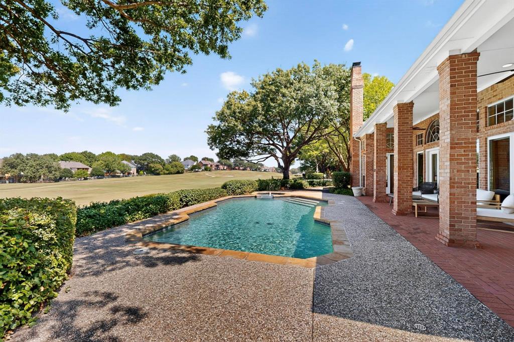 Stunning updated 4-bed, 3-bath home on golf course lot in highly sought-after Stonebridge Ranch! Enjoy breathtaking views of the golf course and lake from your private backyard oasis featuring a sparkling pool, spa, extended patios and lush landscaping. Inside boasts vaulted ceilings, hardwood floors, large picture windows for abundant natural light. The open-concept design connects the kitchen, breakfast area, and main living room, all overlooking the backyard retreat. The remodeled gourmet kitchen offers quartz counters, stainless appliances, 5-burner gas cooktop and oversized butler’s pantry.  Spacious primary suite with fireplace and a spa-like bathroom and second bedroom with full bath downstairs, two additional bedrooms and a full bath upstairs, and oversized garage.  Over $33K+ in upgrades in the last 3 years including pool equipment, AC, water heater, fencing and more. See the list of updates in document.  Enjoy Stonebridge Ranch amenities: beach club, community pool, trails, tennis, pickleball & more. This home is the perfect blend of luxury, comfort, and location. Whether you're entertaining guests or enjoying a quiet evening by the pool, you'll love everything this property has to offer!