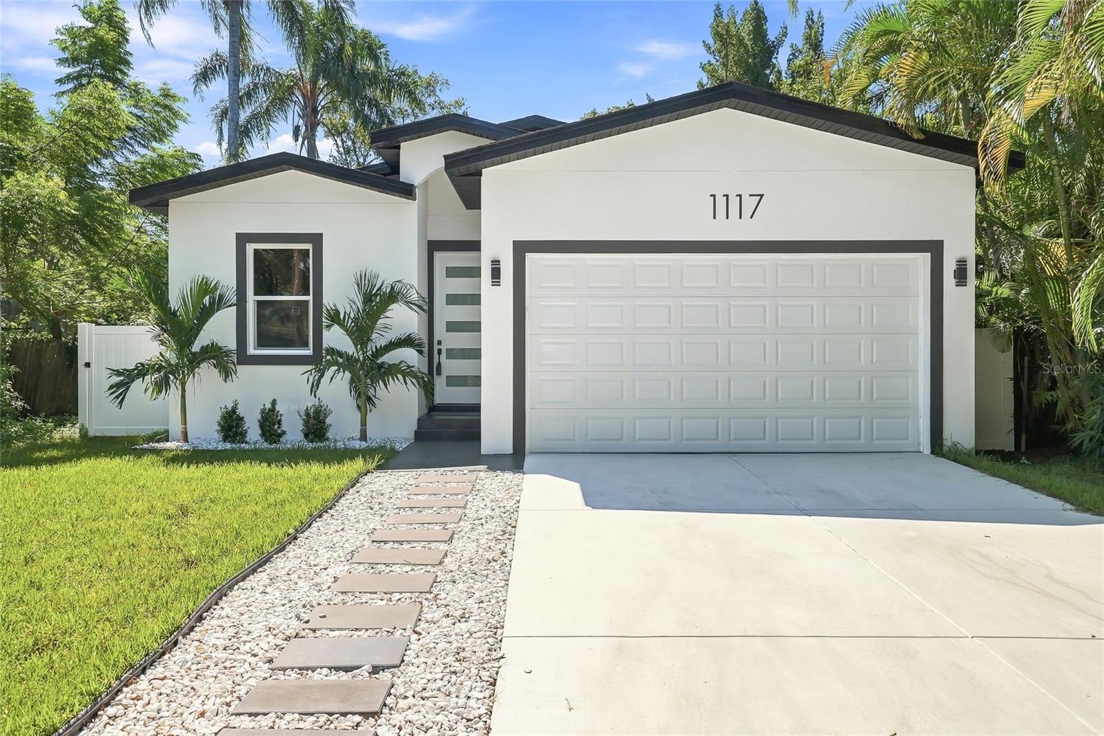 **NEW CONSTRUCTION IN LARGO | NON-FLOOD ZONE Welcome to 1117 15th Ave NW — a stunning, brand-new 3-bedroom, 2-bathroom home offering 1,760 sq. ft. of thoughtfully designed living space, just minutes from the beautiful Gulf beaches. Located in Flood Zone X and approximately 52 feet above sea level, this home combines modern construction, a desirable elevated location, and contemporary style.Step inside to an inviting open-concept floor plan featuring impressive 10-foot ceilings and abundant natural light, creating a bright, airy, and spacious atmosphere throughout. The beautifully designed kitchen showcases upgraded cabinetry, premium countertops, and modern finishes, flowing seamlessly into the living and dining areas — perfect for entertaining guests or enjoying everyday living.The split-bedroom layout offers added privacy for the spacious primary suite, complete with a private en-suite bathroom and an oversized walk-in closet large enough to double as a dressing room.Additional highlights include a two-car garage, brand-new systems and appliances, and quality craftsmanship throughout, offering the benefits of new construction without the need for immediate renovations.Enjoy direct access to the Pinellas Trail right outside your door, ideal for biking, walking, or jogging. You'll also be conveniently located near Largo Central Park, the shops and restaurants of Belleair Bluffs and Clearwater, and the beautiful Gulf beaches just a short drive away.Don't miss this opportunity to own a beautifully crafted new-construction home in Largo! Schedule your private showing today.