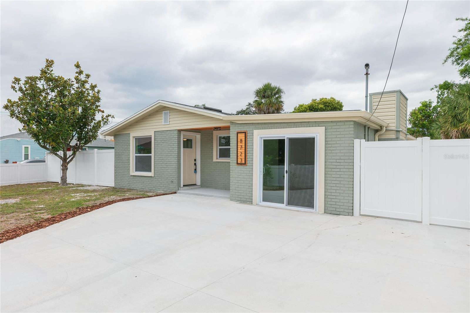 Move-in ready and newly renovated, this spacious 4-bedroom, 2-bathroom concrete block home sits on an oversized corner lot within the Tampa city limits. The interior features tile flooring throughout, a brand-new kitchen with stone countertops, stainless steel appliances, and fully updated bathrooms. The split layout offers comfortable living spaces, modern finishes, and low-maintenance design from top to bottom. Outside, the fenced yard provides privacy and room for outdoor enjoyment. Additional improvements include a newer roof, giving buyers added peace of mind. Located in an area eligible for the City of Tampa’s DARE program, this home offers an excellent opportunity for qualified first-time homebuyers seeking affordability and convenience. With its updates, solid construction, and prime location, this property is ready for its next owner.