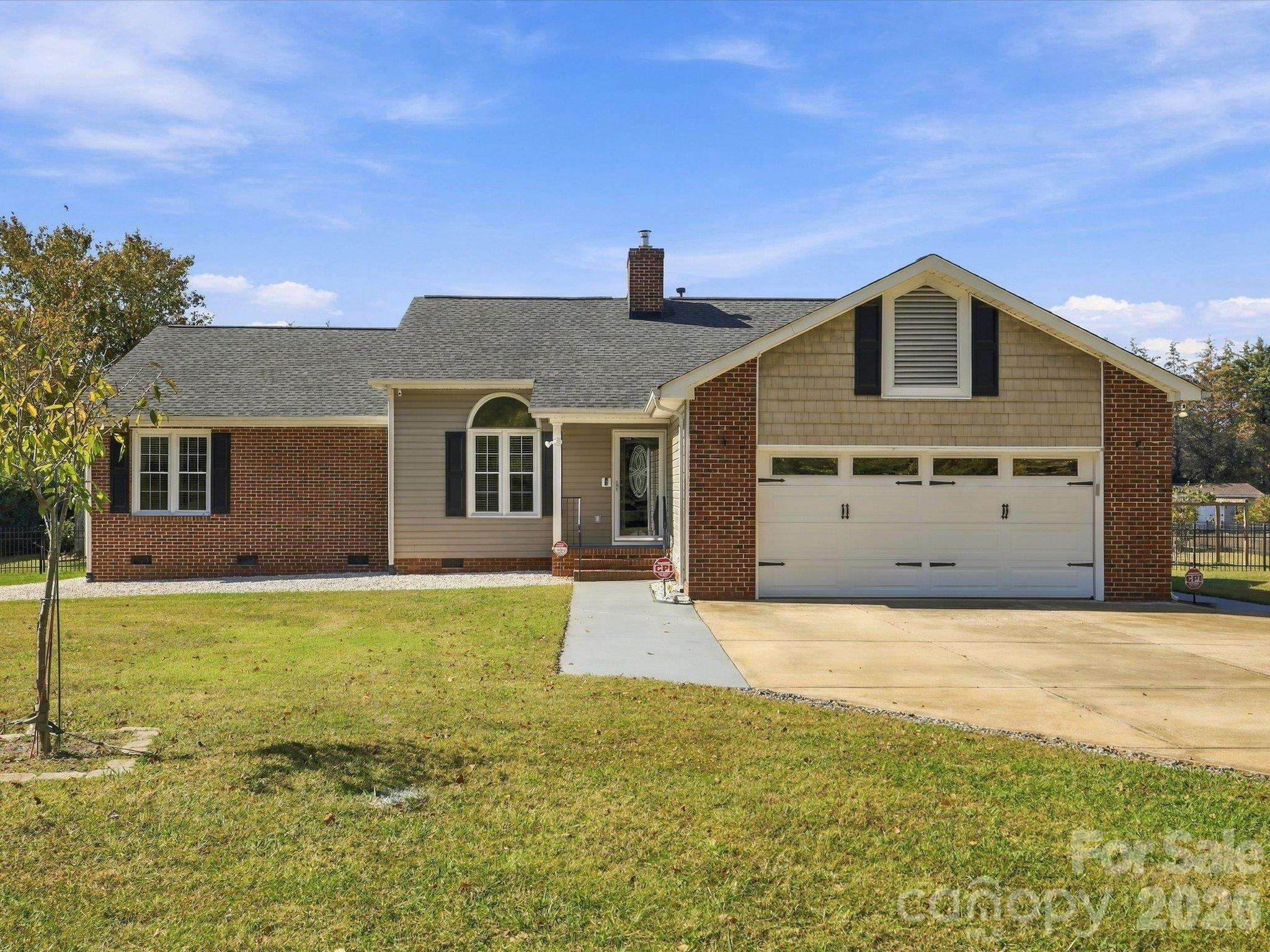 Well maintained peaceful escape in Providence Heights. This 3-bedroom, 2-bath ranch offers over 1,700 square feet and an expanded screened-in back porch on 1 acre of RUD land. Covered front porch leads to a spacious living room with vaulted ceilings and a cozy wood-burning Buck stove fireplace. The bright, roomy kitchen offers skylights and plenty of counterspace, pull out cabinets throughout, connected dining area, and all appliances are included. This home offers a split-bedroom floor plan. The private primary suite has an updated en-suite bathroom with an Onyx resin walk-in shower with grab bars, a soaking tub with a roman faucet, dual vanities with plenty of cabinet storage space, and a walk-in closet. The two secondary bedrooms share an updated full bathroom. The backyard is an oasis with a pergola covered 7-person Viking Spa Tradition II with 63 jets and LED lights - 2023, a 13-foot diameter rock fire pit with Adirondack chairs and plenty of space for extra seating, a 10’ x 13’ Planta Sungrow Urban greenhouse- 2023, raised planters in the yard, storage buildings, a variety of fruit trees and berry bushes, with a completely fenced-in backyard perfect for pets. The 2-car attached garage has overhead storage space and additional parking on the concrete drive. Recent major updates include a 2019 architectural shingle roof, 2024 new gas-pack HVAC (and thermostat) with 12-year warranty including maintenance twice per year, new well tank 2022, upgraded whole house plumbing to PEX 2023, EMP/lightning protection on the breaker box, interior paint 2023, quality high-traffic laminate flooring in the living room and all bedrooms, and 2026 HVAC ducting in the crawl space was replaced. The laundry room, located between the kitchen and primary bedroom, has a utility sink. A number of windows have been treated with heat resistant film to reduce air conditioning costs and hot spots in the home and garage. Please see the full list of updates in the attachments as well as items that the seller is offering for sale. This home has been very well maintained and move-in ready.  Located just outside the Newport community line, the location can't be beat. Easy commute to downtown York, Rock Hill, and the greater Charlotte metro. Low annual taxes!
