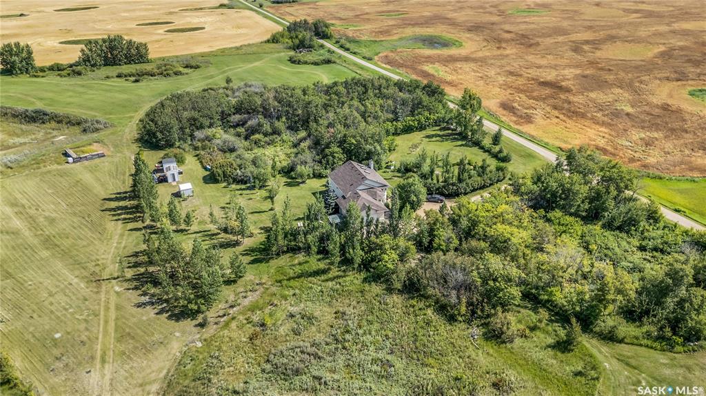Schneider Acreage – Where Country Living Meets City Convenience

Just minutes from the city off Highway 41, this beautifully private 14.26-acre property is tucked behind a mature tree line, offering peaceful seclusion and natural prairie beauty.

At the heart of the property sits a custom-built, fully finished Ehrenburg home, thoughtfully designed for family living, entertaining, or a quiet retirement lifestyle. The home features 4 bedrooms, 3 bathrooms, a newly renovated kitchen and main upstairs bath, a spacious open-concept living area, and a fabulous front entry. You'll love the south-facing skylights, which flood the main living space with natural light throughout the day.

Outside, the property includes a double attached garage, a dugout, and a beautiful shelterbelt of mature trees. With lush garden spaces, open skies, and peaceful surroundings, this acreage delivers the full country lifestyle experience, just a short drive from the city.

Whether you’re sipping your morning coffee under the trees or commuting easily into Saskatoon, Schneider Acreage truly offers the best of both worlds.