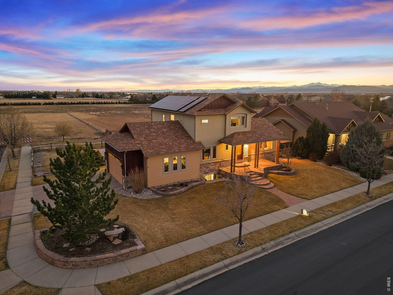 Discover a rare Custom Built Fort Collins retreat that blends modern design, effortless indoor-outdoor living, and forward-thinking energy efficiency, all set against the backdrop of Colorado's iconic Front Range. Positioned in one of Fort Collins' most desirable areas, this home offers quick access to the city's trail systems, vibrant dining, and everyday conveniences, while still feeling tucked away and peaceful. Inside, the open layout is bright and contemporary, anchored by a chef's kitchen with a gas cooktop, generous island, and walk-in pantry. A main-floor office provides the ideal work-from-home setup. Upstairs, the expansive primary suite feels like a private sanctuary, featuring double vanities, a large walk-in shower, and an adjacent loft perfect for a reading nook, fitness space, or lounge. Garage is oversized 2 car with plenty of room for extra storage and toys. Step outside and the home truly comes alive. The resort-style backyard is designed for year-round enjoyment with a built-in outdoor kitchen, covered patio, hot tub, and private pool, an entertainer's dream framed by stunning sunset skies. Energy efficiency is a standout feature: owned solar, room-by-room mini-split heating and cooling, and radiant heat keep utility costs remarkably low while maintaining exceptional comfort. A beautifully designed Fort Collins home where modern living, sustainability, and outdoor enjoyment come together seamlessly.