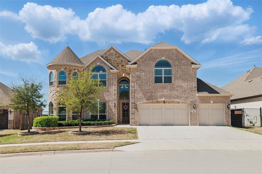 Discover luxury living near Eagle Mountain Lake in this stunning custom home, located in the La Frontera community. This home offers both convenience and elegance! A castle turret front elevation and a grand curved staircase create a dramatic entry. The gourmet kitchen is a chef’s dream, featuring 36” double ovens, a microwave, a 5-burner gas cooktop, a large single-basin sink, a butler’s pantry, and a walk-in food pantry. Expansive counter space, an island, and an extended breakfast bar provide ample room for entertaining, with the choice of formal or casual dining areas. The impressive stone fireplace adds warmth and elegance to the family room. A whole-home water softener and reverse osmosis (RO) system ensure premium water quality. The primary suite is a true retreat, offering a private sitting area, a jetted tub, a separate shower, and dual vanities. A private office with built-in shelves completes the first floor. Upstairs, four spacious bedrooms, each connected by Jack and Jill bathrooms, provide comfort and privacy. A large open area with a half bath offers additional living space. The media room is fully equipped with a projector, receiver, screen, mini fridge, and furniture, perfect for movie nights. Relax outdoors on the covered back porch with a fireplace, ideal for year-round enjoyment. The three-car garage provides ample parking and storage. This community features greenbelts, walking paths, and a splash pad, offering the perfect blend of luxury, space, and an unbeatable location close to major employers within the Fort Worth metroplex. Schedule your tour today!