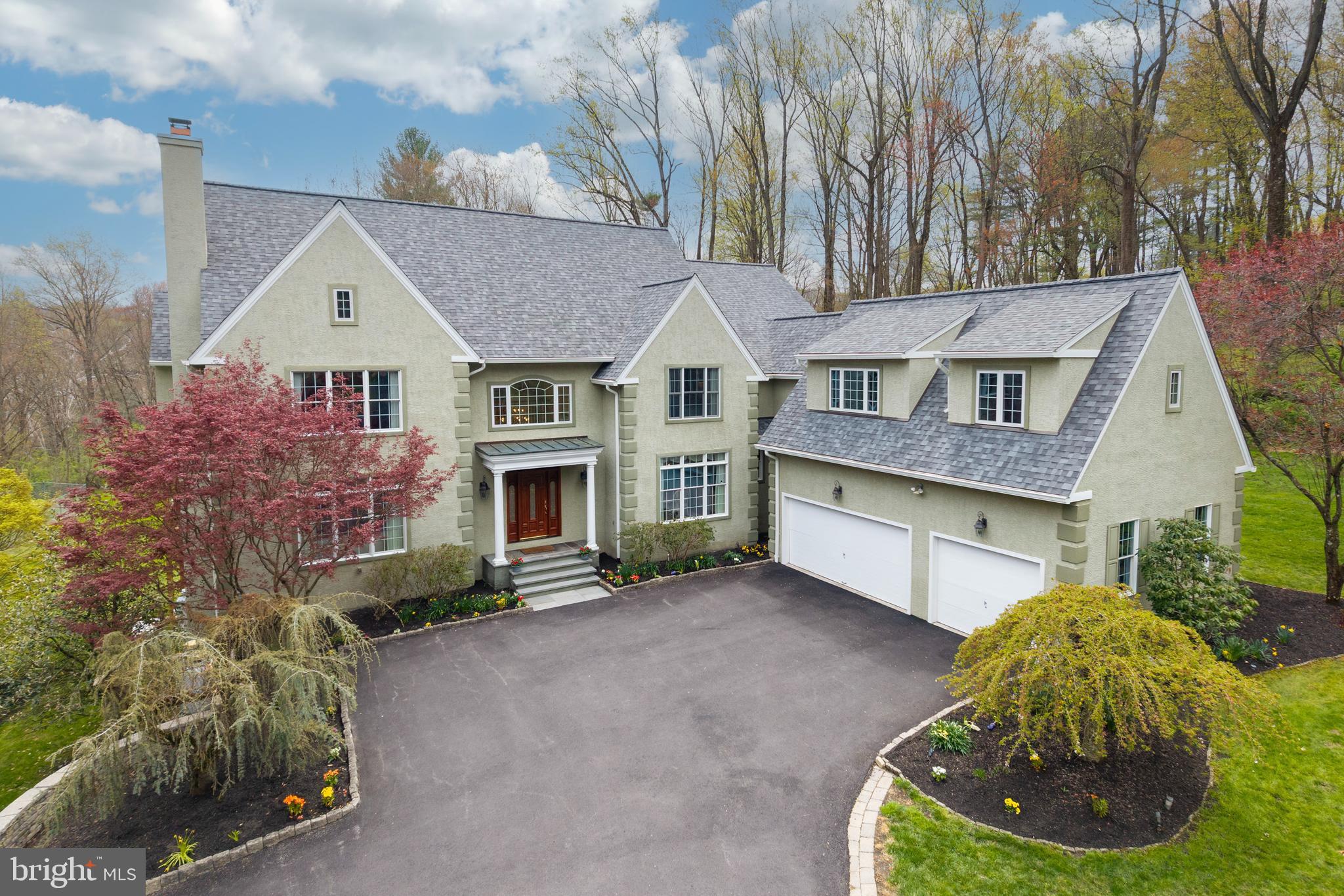 Welcome to 1200 Winderly Lane in Edgemont Township, Newtown Square. This stunning estate home sits on a private 2.36 acre wooded lot and offers 5 bedrooms, 4 full bathrooms, and 3 half bathrooms—perfect for comfortable living and elegant entertaining.A grand foyer opens to a spacious formal living room with fireplace and a large dining room. The sun-filled family room features a vaulted ceiling and gas fireplace, creating a warm and inviting space. The eat-in kitchen is ideal for everyday living and entertaining, complete with a large gas range, center island with seating, and easy access to a walk-in pantry. Just off the kitchen, you’ll find a convenient first-floor laundry room with access to the 3-car garage and backyard. A private home office with its own balcony provides a quiet and functional workspace. Two half bathrooms are conveniently located on the first floor.Upstairs, the home offers 5 generously sized bedrooms and 4 full bathrooms. The primary suite features a large soaking tub, separate glass shower, and a walk-in closet with built-ins. Two bedrooms have en-suite bathrooms, while a Jack and Jill bath connects the remaining bedrooms.  All bedrooms have hardwood flooring and ample closet space. The finished walkout basement adds valuable living space and includes a dedicated home theater—perfect for entertaining or relaxing.  The basement also includes a private flex room, a half bathroom, generous storage space and a cedar closet.Outdoor living is just as impressive with an expansive deck overlooking peaceful wooded views. The property also features raised garden beds with a drip irrigation system, ready for planting. A new roof was installed in 2024.Located in a prime location within the Rose Tree Media School District, this exceptional home offers space, privacy, and timeless appeal in one of Newtown Square’s most desirable settings.