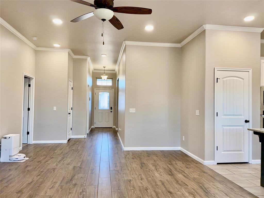 This stunning 3-bedroom, 2-bathroom home available for lease in the highly desirable Deer Creek Schools district, located in The Grove addition of Edmond, OK. This beautiful home features a spacious open floor plan, highlighted by a large living area with a cozy fireplace that flows effortlessly into an elegant kitchen. The kitchen is a culinary delight, equipped with stainless steel appliances, a gas cooktop, granite countertops, and a roomy pantry, and it opens up to a generous dining area with a breakfast bar, perfect for entertaining. The master bedroom features an en-suite bathroom and walk-in closet. The primary bathroom offers a luxurious experience with double vanities, a soaking tub, a separate shower, and a spacious walk-in closet. Enjoy the outdoors in your expansive backyard, complete with a covered patio for relaxation and gatherings. Additional features include a convenient storm shelter for added safety, newly installed EV charger with a 32-amp output in the garage, and two-car garage for ample parking and storage. Also, there is an additional custom-built storage shed in the backyard. Pets are permitted on a case-by-case basis, and the refrigerator is included. This home is conveniently situated with easy access to dining, shopping, and entertainment. The neighborhood provides fantastic amenities like a gym, pool, and parks ensuring a vibrant lifestyle for you and your family.