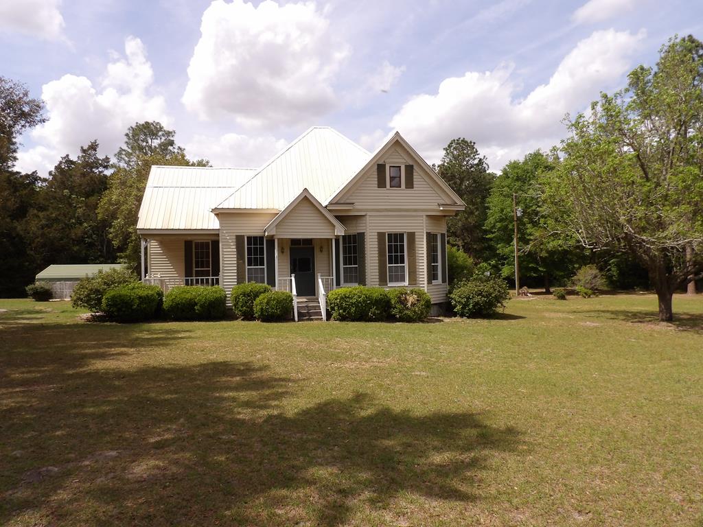 This 112 year old historic home is available for someone that loves fixing up and preserving a classic old country home that sits on 2 acres completely fenced.  The structure is sound but needs some interior attention.  There are 3 bedrooms and 2 and 1/2 bathrooms.  The central unit was replace in 2024 and metal roof installed about 12 years ago.   A must see to appreciate.