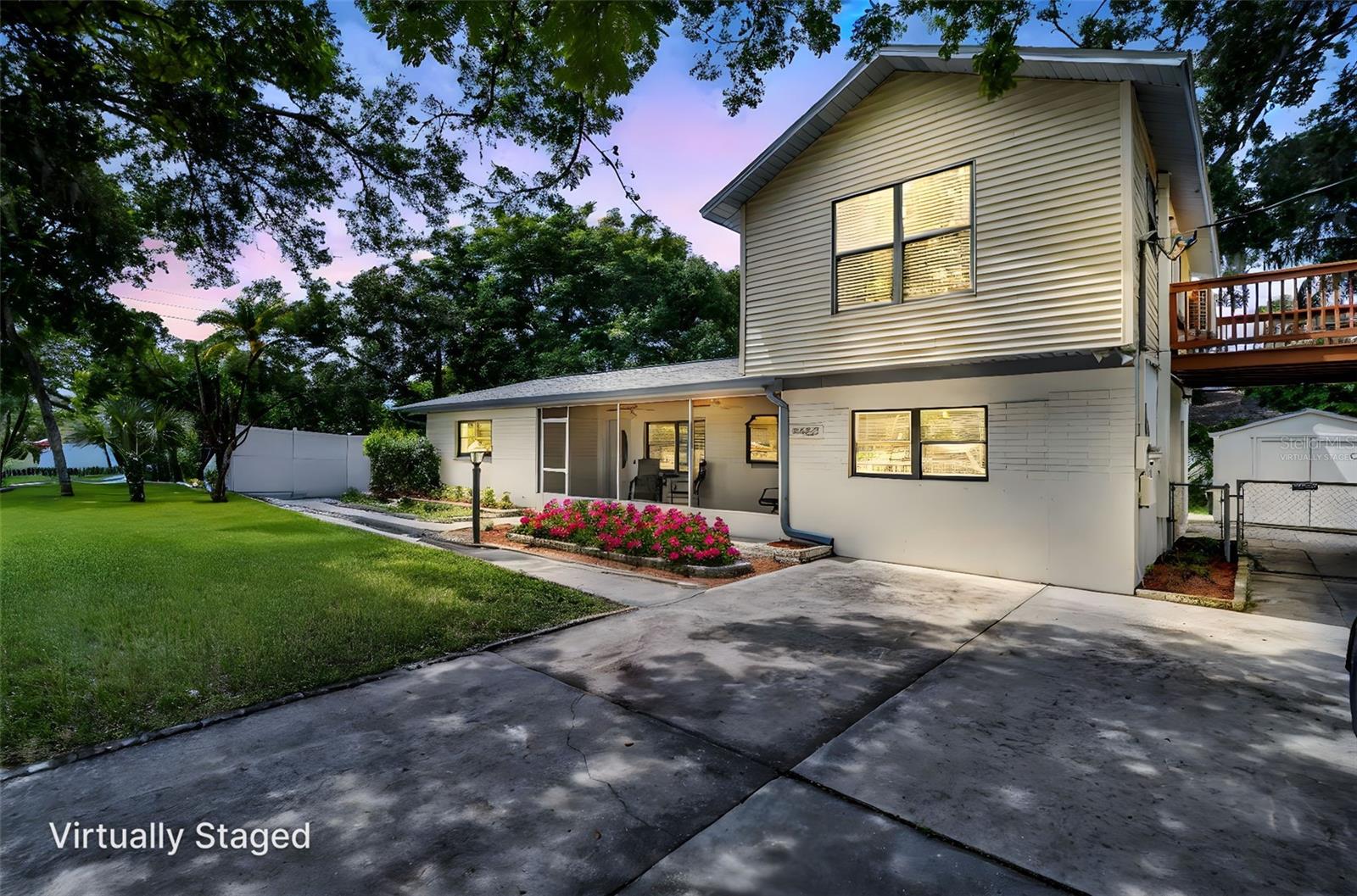 Welcome to 1225 15th St., Palm harbor FL 34683. A spacious single-family home on a 115' x 75' corner lot just steps from the vibrant heart of downtown Palm Harbor. Nestled in a golf cart friendly community, this property offers the perfect blend of small town, charm and coastal living, with restaurants, shopping, and the Pinellas Trail, all within close proximity, and the Gulf of Mexico and honeymoon Island less than a mile away. This versatile home, boasts an open floor plan with durable vinyl flooring, two screen patios, front and rear, for you around enjoyment, and a fenced backyard with 2 storage sheds. The unique layout includes a second floor suite with a private balcony, ideal for multigenerational, living, a guest retreat, or potential rental income. Recent updates provide provide peace of mind, including a five year-old roof, newer, water heater, two years, and AC system, four years. With ample parking for RVs, boats, or multiple vehicles, and no homeowner association, restrictions, or fees, you'll enjoy true freedom, and flexibility, and enjoy cooking in your new stunning gourmet kitchen with stainless appliances. Located near highly sought after Palm Harbor University schools, this home, combines convenience, comfort, and endless possibilities in one of Pinellas county's most desirable neighborhoods. Key features include large corner lot, open floor plan with vinyl flooring, screened patios, 2 outdoor sheds, fenced yard, second floor suite with balcony and potential income with private entrance, parking for RVs, boats and more. 35 minutes to Tampa international airport for convenience of travel and a wonderful lifestyle in downtown Palm Harbor.