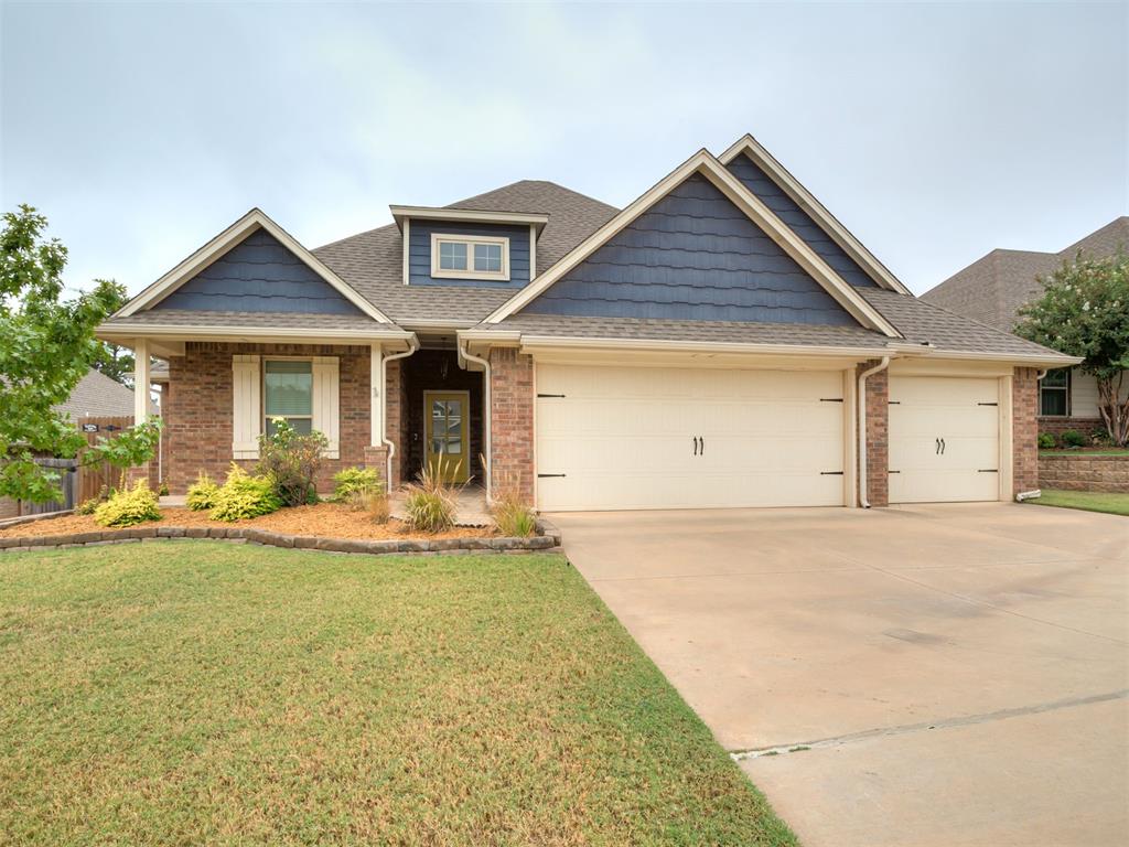 Built in 2019 in Edmond's Woodland Park, this 4-bedroom, 2-bath brick home offers 1,850 sq ft of single-story living, a 3-car garage, and Edmond schools. Navy shake gables, a sunny yellow front door, and stone-edged landscape beds make a great first impression.Wood-look tile runs through the entry, living, kitchen, and dining areas, with crown molding and recessed lighting throughout. The living room centers on a stacked-stone fireplace framed by windows and opens to the kitchen and a vaulted dining area, an easy layout for everyday living and hosting. The kitchen features a long island with seating for four, white quartz counters, an arabesque tile backsplash beneath a custom hood, a gas cooktop, built-in wall oven and microwave, stainless dishwasher, and pantry. White uppers paired with stained lower cabinets give it a warm two-tone look.The primary suite has a tray ceiling and ceiling fan. Its bath offers a double granite vanity, soaking tub, separate tiled walk-in shower, private water closet, and a walk-in closet with built-in shelving that connects directly to the laundry room. The laundry adds granite counters, cabinets, a hanging rod, and patterned tile. Three secondary bedrooms have ceiling fans and double-door closets, and the hall bath includes a granite vanity and tiled tub/shower. Out back, the covered patio has a brick outdoor fireplace and ceiling fan, overlooking a fenced yard with room to play and garden. Woodland Park residents enjoy a clubhouse, a resort-style pool plus a separate splash pool, multiple playgrounds, basketball courts, an open play field, and walking trails around the neighborhood ponds. Come check out this great place to live!