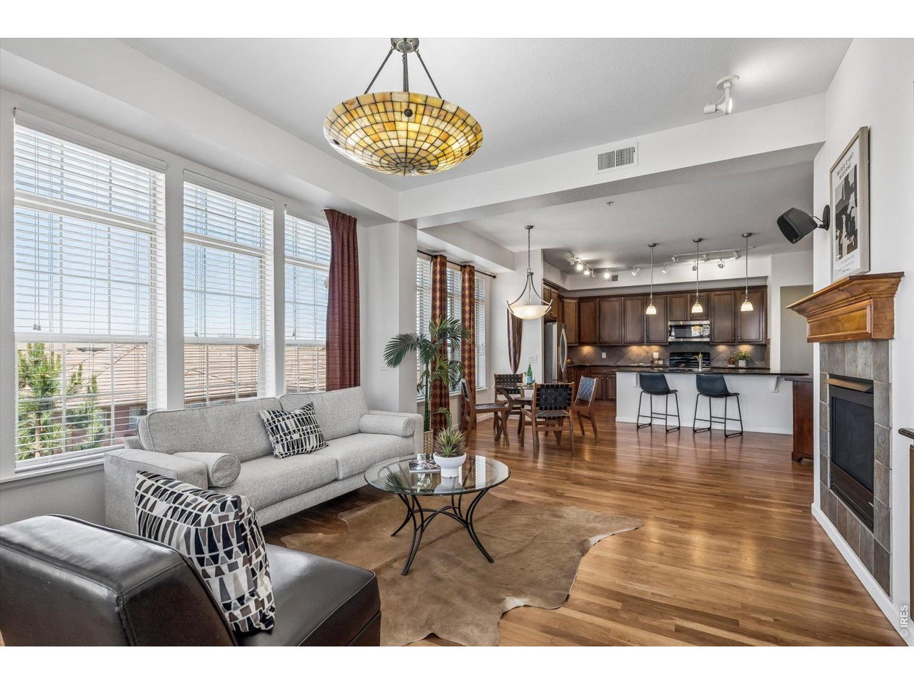 Seller Incentive: 5.99%* mortgage rate available to qualified buyers through Canvas Credit Union, subject to lender approval and program terms. Restrictions apply; contact lender for details. Rare opportunity in Vallagio at Inverness! Stunning 3rd-floor corner/end-unit condo offers 2 bedrooms plus study, exceptional natural light, 10' ceilings, cherry hardwood floors, and beautiful views. The open floor plan features a spacious great room with a gas fireplace, elegant dining area, and well-appointed kitchen with granite island and stainless-steel appliances. Enjoy seamless indoor/outdoor living from the generous balcony with room for dining and seating plus a gas BBQ connection. The private primary suite includes dual sinks, walk-in shower, and large walk-in closet. A flexible second bedroom features a Murphy bed and built-in desk-ideal for guests, office, or fitness space. Additional amenities include in-unit laundry, same-floor storage, and two indoor parking spaces with direct elevator access. Enjoy a true lock-and-leave lifestyle just steps from Vallagio Town Center's restaurants and shops, with easy access to light rail, DTC, and major highways. Located in the coveted Cherry Creek School District, with Inverness Golf Club membership available.