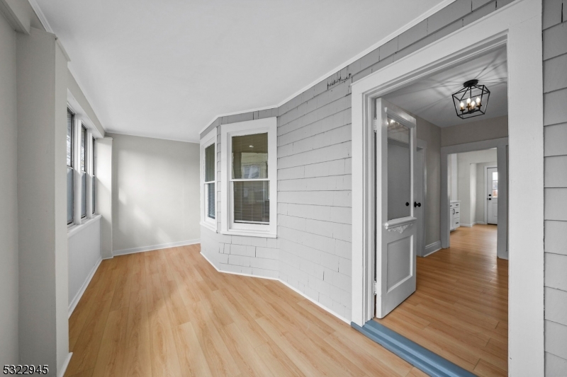 Updated and upgraded! This charming colonial is much larger than it appears! Located just steps from Hillside Avenue School & a short walk to award-winning downtown Cranford, this is an unbeatable location. Enter into the enclosed front porch, providing the perfect mudroom or space for additional storage. Inside, a warm foyer welcomes you with original millwork and classic staircase, setting the tone for the rest of the home. The formal living room provides generous entertaining space and flows into a bonus office/den space just off the main floorplan, providing the perfect homework or work from home setup. Just beyond, the formal dining area opens into brand new kitchen with white cabinetry, quartz countertops, new stainless steel appliances, and numerous windows providing natural light and views of the yard. Upstairs, there are 3 sizeable bedrooms and the brand new full bath. A walk-up, finished attic provides the 4th and final bedroom. The basement provides a laundry area, a second brand new full bathroom, and plenty of storage space. The backyard provides green space and an exceptional, expanded blacktop driveway with parking with 4 cars (fully fenced and gated, as well). Move right in!