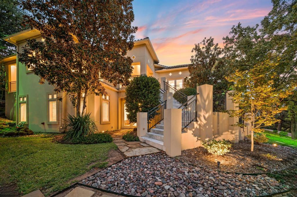 Wide-open views! One of a kind custom home perched atop a scenic hillside, this MOVE IN READY updated stunning residence built by Bailey Draper captures sweeping views and timeless elegance. This property is one of a kind! Set on over half an acre, this unique modern home blends sophistication with comfort—perfect for both everyday living and grand entertaining. Step through the impressive entryway onto beautiful hardwood floors that flow throughout the open-concept main level. Expansive terraces and soaring ceilings fill the home with natural light, creating a bright, inviting atmosphere. The formal study and dining room each offer terrace access, ideal for indoor-outdoor gatherings. The gourmet kitchen is a chef’s dream, featuring a built-in refrigerator, gas cooktop, stainless steel appliances, quartz countertops, and a spacious island. The private primary suite offers its own balcony access and a see-through fireplace leading into a spa-inspired bath with a jetted tub and glass shower. Entertainment spaces abound—including a game room, media room, and convenient kitchenette—all accessible by elevator. Generously sized secondary bedrooms provide comfort and privacy for family and guests alike. The Exercise Room could be a 5th bedroom with a walk-in closet and en suite bath. Outside, the covered patio overlooks a sparkling pool and attached spa, with an outdoor fireplace creating the perfect setting for year-round relaxation and entertaining. Located in award-winning Grapevine-Colleyville ISD, this exceptional home combines luxury, function, and unforgettable views in one extraordinary package. Conveniently situated between Dallas and Fort Worth, as well as excellent access to the Dallas Fort Worth International Airport. Within minutes of Historic Downtown Grapevine and Southlake Town Square offering endless dining and shopping options!