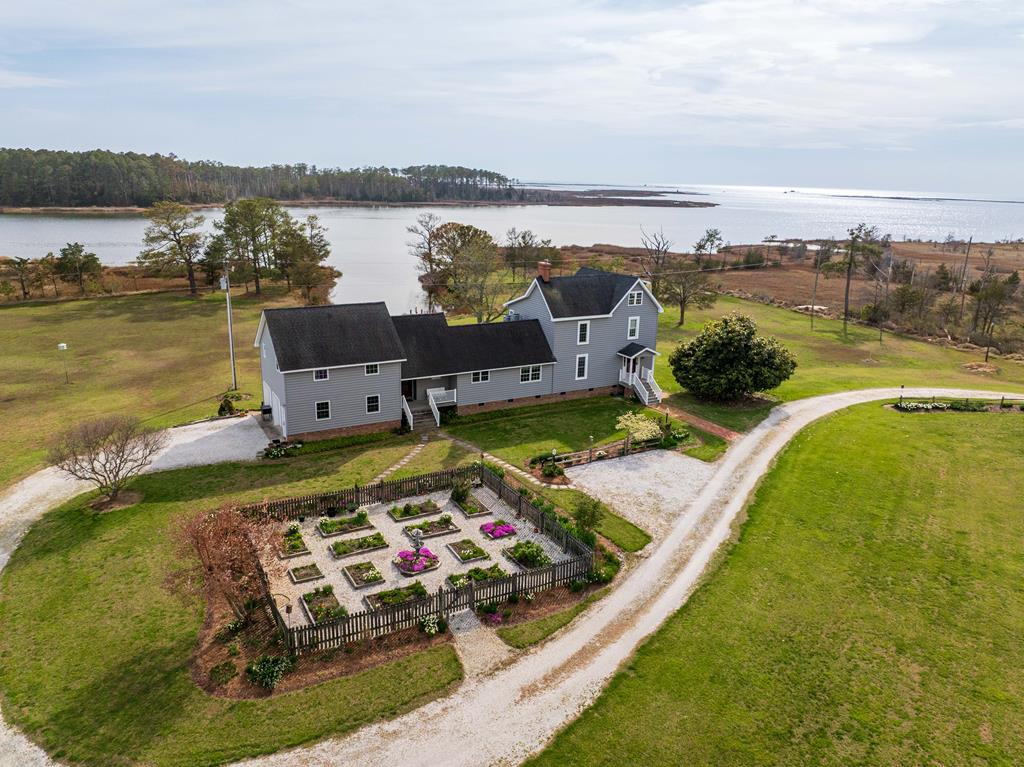 This wonderful home boasts expansive views of Matchotank Creek all the way out to the Chesapeake Bay. Purchased in 1978 the current owners have meticulously restored the home to what you see today. Interior features include; beautiful hardwood floors, custom cabinetry, wood work, surround sound, primary private suite, and views of the creek from practically every window. Exterior features include; fresh water pond, formal Williamsburg garden, vegetable garden, pasture area, large detached garage combination workshop, plus storage. The sunsets are the most amazing that you will ever see. Check out the 3D tour to get a true understanding of the home's layout. Plan your trip today to visit this wonderful property, don't let it slip out of your hands.