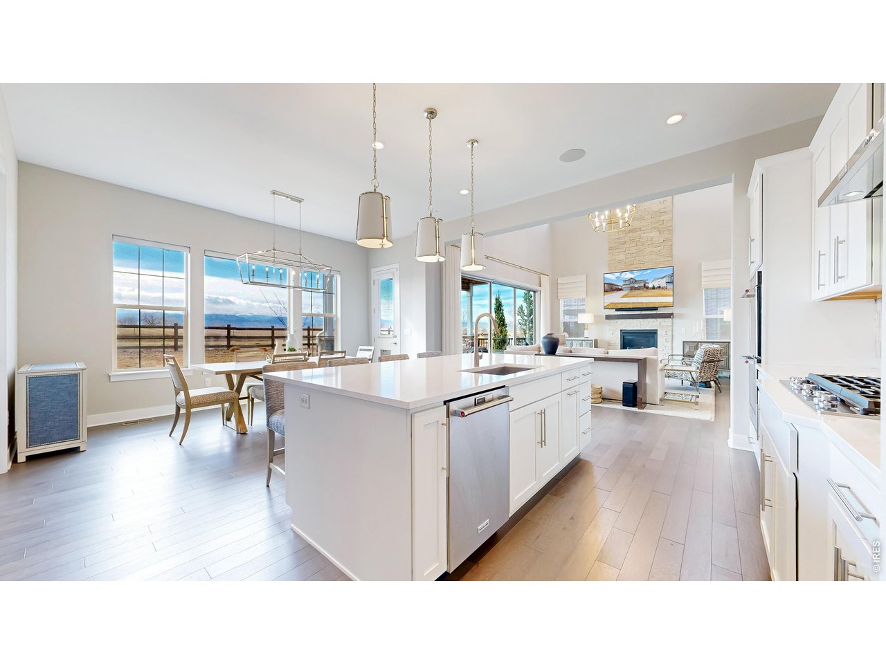 Now offered at $1,799,000! Buyer may receive a 1% lender credit when using the seller's preferred lender. Set on a quiet cul-de-sac in desirable Flatiron Meadows, this exceptional Toll Brothers home pairs breathtaking, unobstructed Front Range mountain views with over 5,000 finished square feet and seamless indoor-outdoor living.From the moment you enter, the mountains take center stage. Expansive windows and retractable glass doors frame the views and fill the open main level with natural light. The vaulted great room flows effortlessly into the chef's kitchen featuring quartz countertops, stainless steel appliances, gas cooktop, double ovens, oversized island, and walk-in pantry. Open the glass doors to the covered, expanded patio and enjoy Colorado sunsets against a spectacular mountain backdrop.Thoughtful designer details elevate the home throughout, including custom paneled walls and updated lighting in the dining room, a private office with built-in cabinetry, and a statement powder room. A main-floor guest suite provides wonderful flexibility for visitors or multi-generational living.Upstairs, the spacious primary suite is a true retreat with panoramic mountain views, a luxurious five-piece bath with soaking tub and separate shower, and a generous walk-in closet. Additional bedrooms are well-sized with convenient access to full bathrooms.The finished basement offers even more room to gather with a theater area, recreation space, additional bedroom, and full bathroom. Outside, the professionally landscaped and fully fenced backyard provides an incredible setting for entertaining, relaxing, and taking in the views.With five bedrooms, five bathrooms, a three-car garage, neighborhood parks and trails, and one of the most memorable mountain settings in Erie, 750 Limestone offers the space, design, and Colorado lifestyle that make this home truly special.