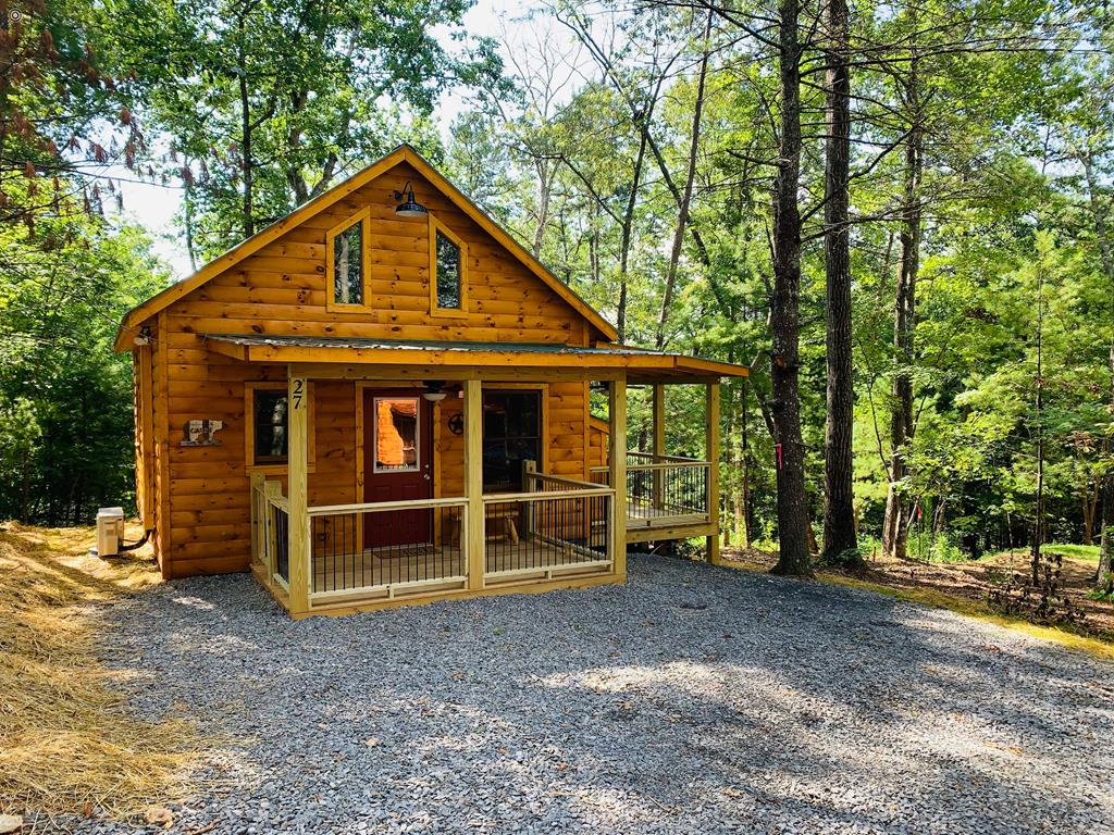 Murphy NC-Furnished Tiny Cabin w/ loft.  This tiny cabin has big charm.  The only thing missing from this cabin is you.  Minutes from downtown Murphy, a the quaint little town that plenty of dining and shopping options, or for the adventurous the Ocoee and Nantahala Rivers are a short drive away. This cabin also produces a rental income for the investor. The possibilities are endless.