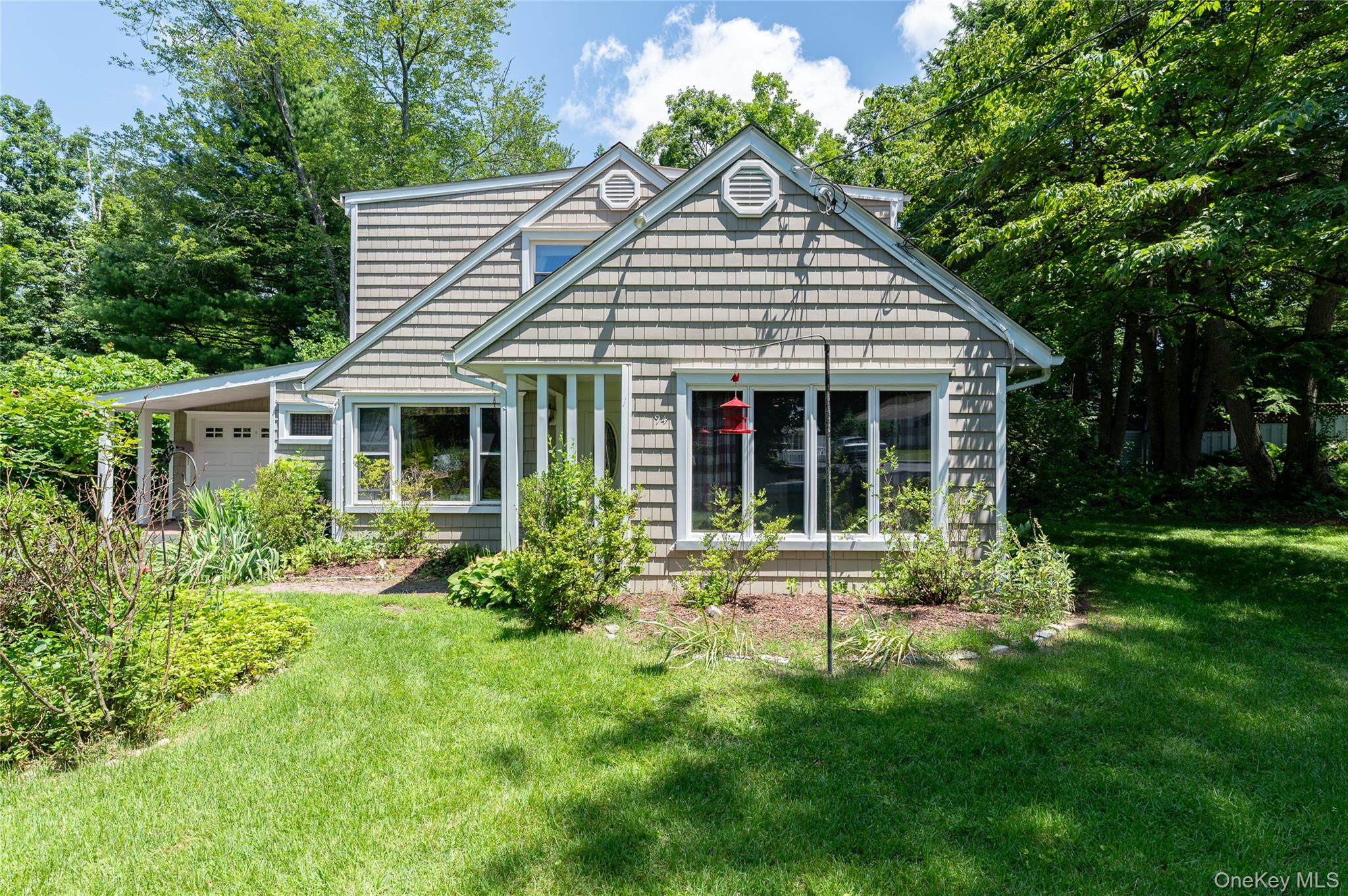 Charming and full of character, this 4-bedroom, 1.5-bath Cape Cod-style home is set on a private and peaceful parcel. The entry opens to a cozy living room with a wood-burning fireplace, creating a warm and inviting atmosphere.  Natural light pours into the kitchen and dining area through oversized windows, enhancing the warmth and openness of the space.  A convenient mudroom with generous storage leads out to a screened-in porch perfect for relaxing and enjoying the outdoors. Two bedrooms and a full bath offer flexible options for one-level living or guest accommodations. This thoughtful layout completes the main level. Upstairs, you'll find two additional bedrooms and a half bath. The Primary bedroom features a bonus room that offers possibilities as a walk-in closet, dressing area or home office. Set in a walkable neighborhood that encourages leisurely strolls and a sense of community, this home is just minutes from Mount Kisco Country Club, shopping, dining, and Westchester Medical Center. Metro North is a short drive away, making commuting and weekend escapes a breeze.