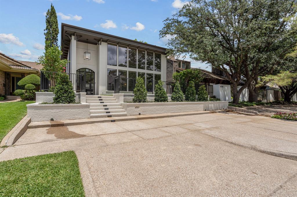 Just steps from Rivercrest Country Club, this fully renovated and expanded 4-bedroom, 4.1-bathroom home offers 4,344 square feet of thoughtfully designed living space. Renovated by Randall Sears with interior design by Jessica McIntyre, the home blends elevated finishes with functional elegance.

The main level features soaring ceilings in the foyer and living room, a showstopping kitchen with Taj Mahal quartzite countertops and full-height backsplash, top-of-the-line appliances including a Wolf range and built-in Jenn-Air refrigerator, and a full wet bar with wine fridge and ice maker. Enjoy everyday meals in the spacious kitchen dining area and host guests in the formal dining room that seats up to 10.

The primary suite is a true retreat with a spa-like bath—complete with soaking tub, rainfall shower, dual vanities, and custom walk-in closet. A downstairs guest suite lives like a second primary. Automatic blinds add convenience throughout the main living spaces, along with a chic centrally located powder bath.

Upstairs offers two additional bedrooms, two full baths (including an en-suite), and a versatile media room that could easily serve as a home office. A newly built rooftop deck expands the living space.

Outdoor features include a private elevated courtyard, a side yard with artificial turf and a putting green, and a grassy backyard area perfect for pets. A two-car garage with fresh epoxy floors and bonus front parking completes this exceptional property.