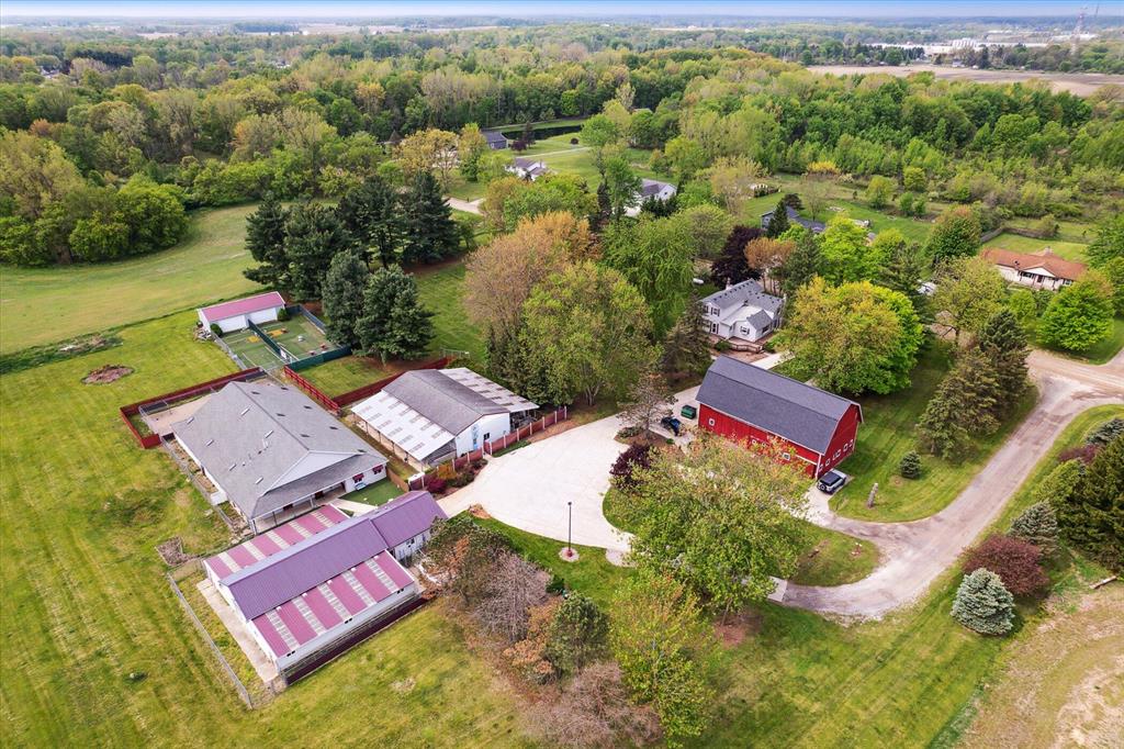 A rare opportunity to live and work in one exceptional property. This quaint old farmhouse is perfectly paired with a successful, well-established dog kennel and doggy daycare, offering endless potential for the next owner. The home sits on over 11 beautiful acres, providing privacy, space to expand, and room to grow both personally and professionally. The business portion of the property features three super-clean, well-maintained kennel buildings, a dedicated cat room, grooming area, daycare building, and a fully fenced play yard. In total, there are six outbuildings, all thoughtfully laid out for efficient daily operations. The kennel facilities have their own private well and septic, allowing the business to operate independently from the residence. The charming farmhouse offers the unique ability to live directly on site, rent the home to a family, or house a business manager--providing flexibility and additional income potential.With ample acreage, there is plenty of room to expand the home, the kennel operation, or both.Ideally located just off Grand River, this property offers excellent accessibility and is a perfect option for Lansing commuters, all while enjoying the space and tranquility of Livingston County. Whether you're an experienced kennel operator or an entrepreneur looking for a turnkey business with a built-in residence, this one-of-a-kind property truly delivers.