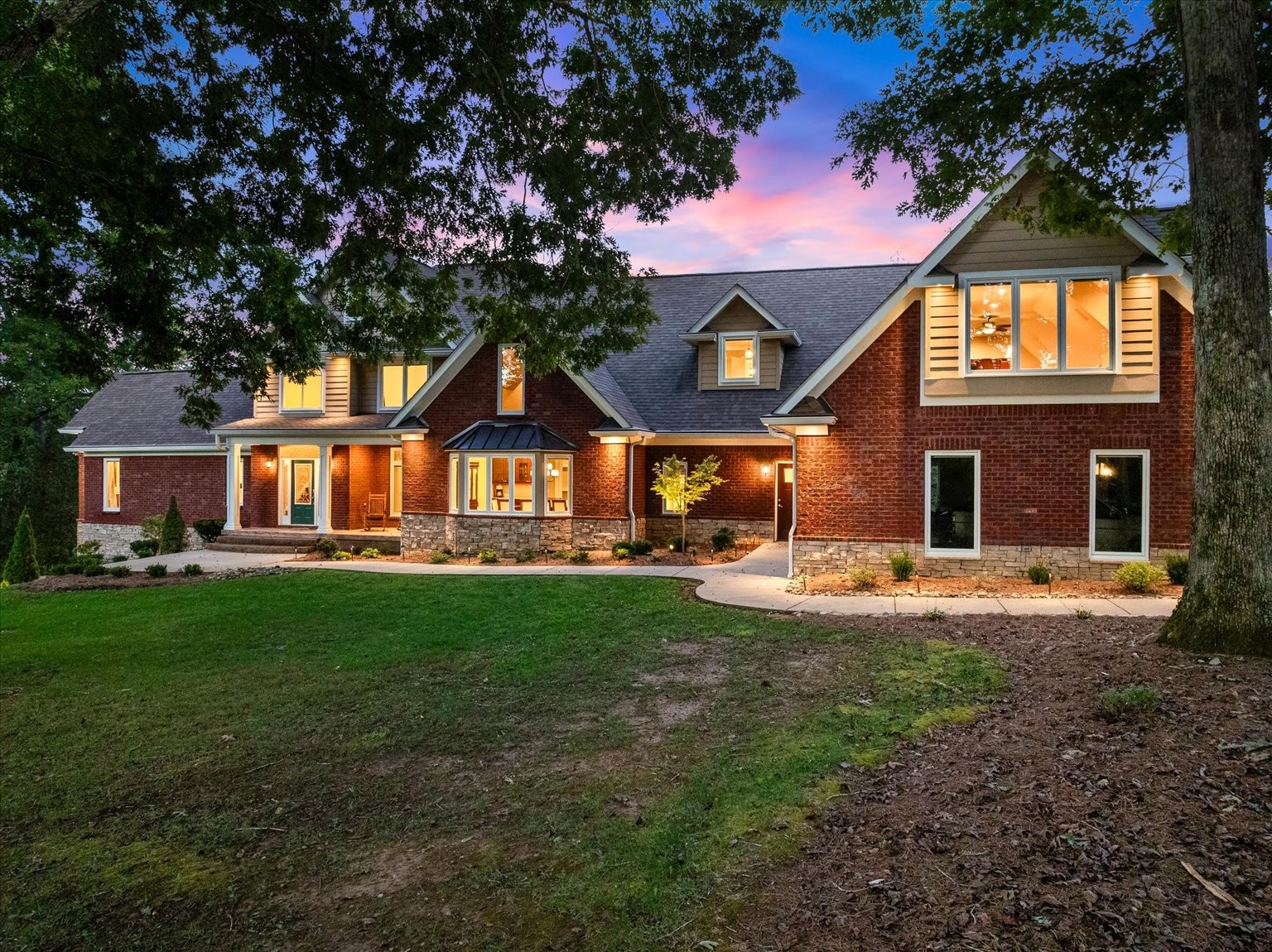 Nestled on 19 stunning acres, this 7,100 sq ft custom estate offers luxury, privacy, and space to live and entertain. The home features 3 bedrooms, 3 full baths, 2 half baths, 2 laundry rooms, and a walk-out basement with additional living space. A chef’s dream kitchen includes double ovens, two dishwashers, a gas cooktop, built-in refrigerator, and an oversized island, all framed by floor-to-ceiling cabinetry and generous counter space. The expansive layout boasts a formal dining room, two media/rec rooms, flex rooms ideal for additional sleeping quarters or offices, and a spa-like primary suite. Hardwood floors run throughout, with two gas log fireplaces adding warmth and charm. Oversized Pella windows with retractable screens flood every room with natural light and frame breathtaking views of the property. Enjoy outdoor living with a private in-ground pool and take advantage of the abundant storage found throughout the home.