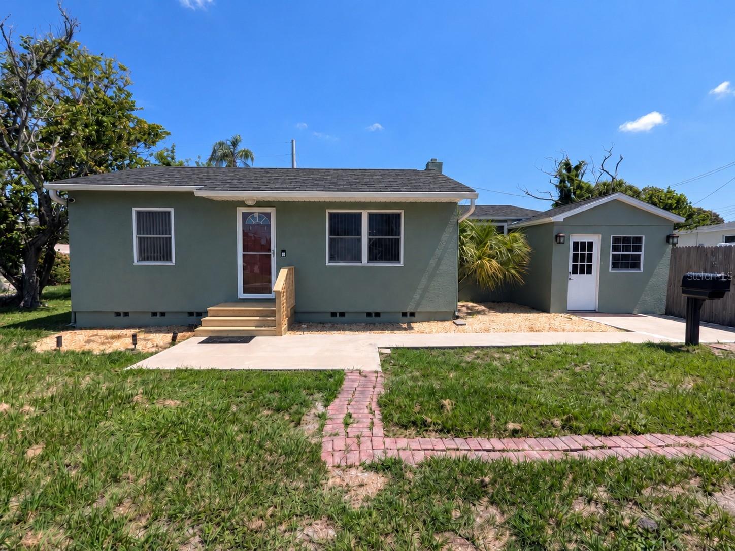 Incredible location- North Kenwood is always booming, BRING ALL OFFERS!! Don't miss your opportunity to enter this hot spot neighborhood at a great price! CORNER LOT Zoned NT-1, this property is PERFECT for building an ADU (Additional Dwelling Unit) on site. Generate income on your own property, or give your mother-in-law her very own home in your sideyard! Located on a beautiful CORNER LOT in a NON-FLOOD ZONE, this 952 sqft home is ready for its new owner. With new roof improvements (2026), a 2017 AC unit, newly remodeled bathroom, newer windows in the enclosed east wing of the home, newer exterior paint job, and a LARGE side yard (for pool or ADU), this home is sure to check all of your boxes! You will love the dining/office/den space directly off of the kitchen AND the cinderblock converted extra "game room" that hosts the INDOOR LAUNDRY closet (all included in the home's square footage, per County tax records!) - this is the house that keeps on going! Located only moments away from the famous Mazarro's Italian Market, I-275, St Pete's award-winning beaches, and all of the bars/restaurants/shops in bustling Downtown St Petersburg, this home is the epitome of "Location, Location, Location!" Call today for your private showing- you'll be glad you did!
