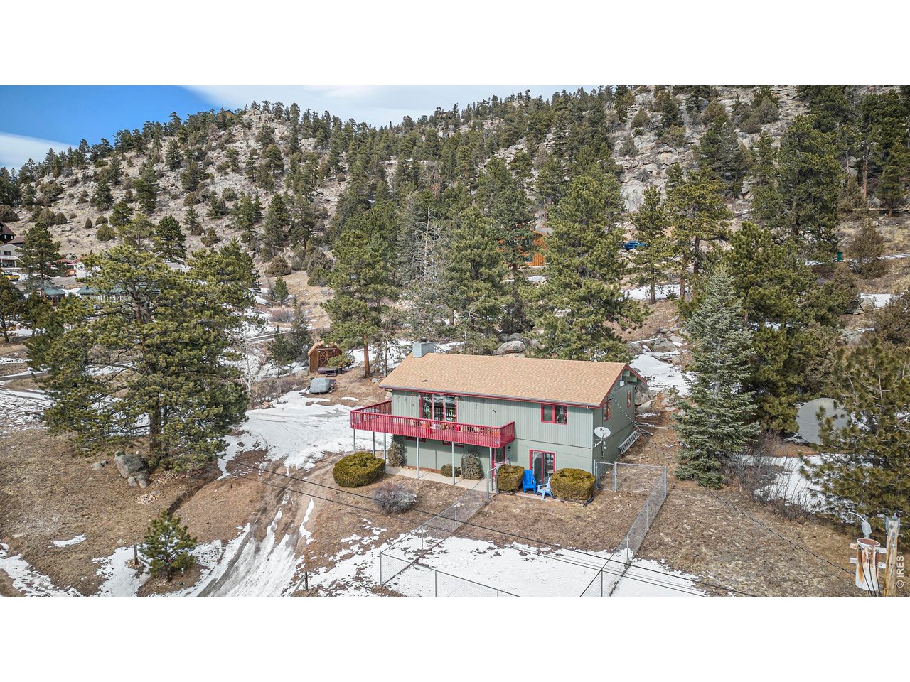 Set on a generous corner lot with sweeping mountain views, this thoughtfully cared-for home offers flexibility, comfort, and character throughout. Vaulted ceilings, knotty cedar walls, and updated maple flooring create a welcoming mountain feel, while the open main living area provides an easy flow for everyday living and entertaining. The lower level features two private ensuite retreats, each with its own exterior entrance. One offers a spacious bedroom, sitting area, study, and 3/4 bath. The second is an expansive 24' x 16' suite complete with a full bath, walk-in closet, and kitchenette, ideal for guests, multi-generational living, or a luxurious primary suite. Upstairs, two additional bedrooms share a full bath, offering comfortable accommodations for family or visitors. Outdoor living is equally inviting, with a large deck, wrap-around front balcony, and multiple patio areas designed to take full advantage of the mountain setting and outdoor relaxation. The high-output well includes a newer well pump and heated water lines for added year-round reliability. With versatile living spaces, inviting outdoor areas, and beautiful views in every direction, this property offers the ideal blend of mountain charm and everyday functionality.