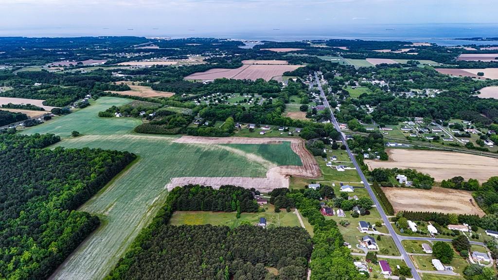 Discover the perfect blend of space and serenity with this 3.19-acre lot located in Sunnyside Estates in Cheriton, VA. Just minutes from the charm of historic downtown Cape Charles and the waterfront village of Oyster, this property offers an ideal setting for your custom home. Buildable areas total 3.01 acres with an additional .18 acre sewer lot. Convenient access to nearby dining, shops, beaches and marinas. Whether you are looking to build now or hold for the future, this lot offers a fantastic opportunity with plenty of flexibility and no restrictions from a homeowners association or additional town taxes.