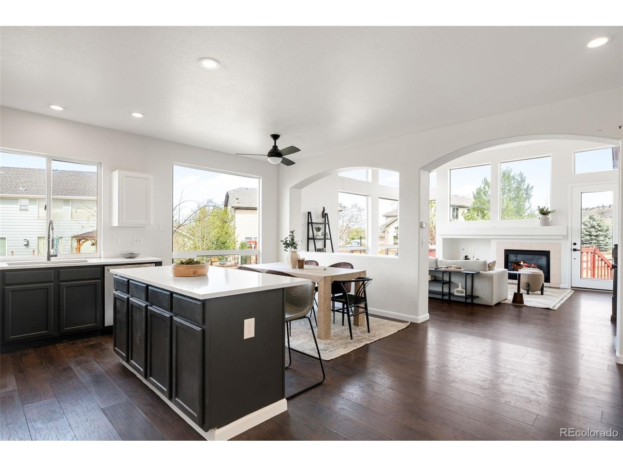 Welcome to this move-in ready 5-bedroom, 4-bath home in Castle Rock's sought-after Metzler Ranch community, offering an ideal blend of space, comfort, and Colorado lifestyle. A south-facing driveway provides easier winter maintenance, while no immediate neighbor to the west offers added privacy and a sense of breathing room. The open floor plan features a front formal dining room that functions perfectly as a home office or flex space. The updated kitchen includes new appliances (all new except the refrigerator, just over one year old), new countertops, a pantry, and flows seamlessly into the living room. The living room showcases vaulted ceilings, a gas fireplace, and large windows overlooking the greenbelt, filling the home with natural light and peaceful views. The main-level primary suite is generously sized and designed as a true retreat, complete with a five-piece ensuite bathroom and walk-in closet, and plenty of room for a sitting area, home gym, or yoga space. Upstairs offers three spacious bedrooms, a recently updated full bathroom with a double vanity, and a large open loft ideal for a playroom, homework area, or second living space. The finished basement adds exceptional flexibility with a new bedroom and full bathroom, with additional space to make it your own. Major upgrades include a new 2024 Class 4 impact-resistant roof, along with new carpet throughout and fresh interior paint, making this home truly turnkey. Located in the Metzler Ranch neighborhood of Castle Rock, residents enjoy a suburban lifestyle with access to trails, open space, and mountain views. With quick access to I-25, commuting to Denver (approx. 50 minutes) or Denver International Airport (approx. 40 miles) is easy. Positioned between Denver and Colorado Springs, this home delivers the best of Front Range living.