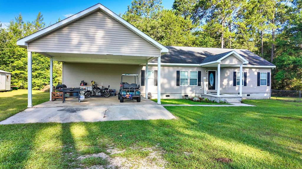 Welcome to 107 Mossy Creek Way—where comfort, space, and charm come together on a generous 0.89-acre lot. This 4-bedroom, 2-bathroom home offers a thoughtfully designed layout featuring two separate living areas, perfect for entertaining or spreading out. Cozy up by the fireplace, or enjoy casual evenings in the second living space. The kitchen is a standout with a mix of solid surface and butcher block countertops, ample cabinet storage, and a practical layout that makes cooking and gathering a joy. A large laundry room with a utility sink adds convenience and function to your daily routine. The expansive primary suite is a true retreat, complete with a walk-in closet, dual vanities, a soaking tub, and a separate shower. Every inch of this home is designed for relaxed, everyday living—with plenty of space both inside and out. Tucked away at the end of the culdesac, this property offers the privacy of country living with easy access to nearby amenities. Come experience the comfort and charm for yourself!