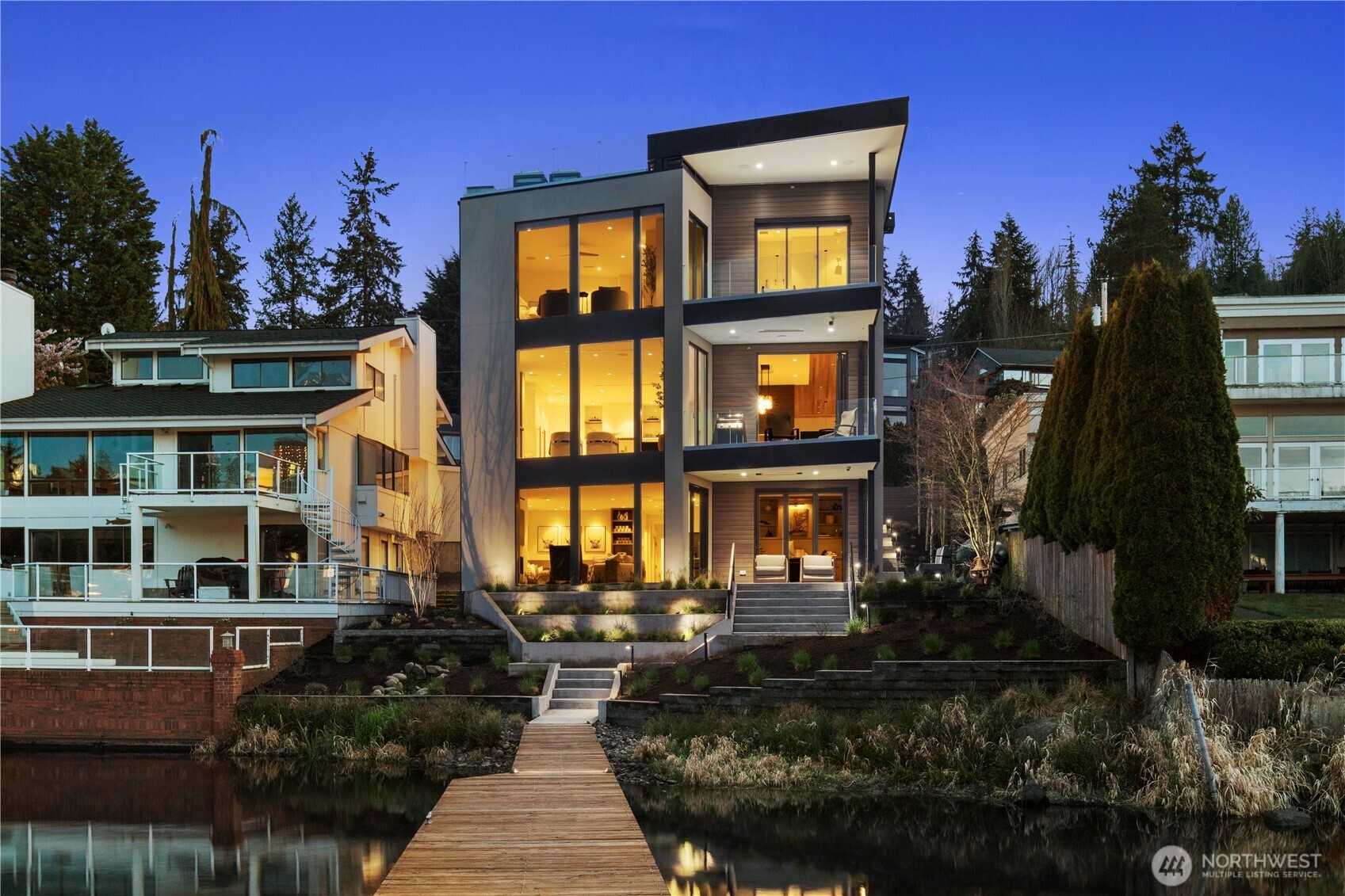 Experience elevated luxury reimagined by Dandi Studios, this fully remodeled masterpiece completed in late 2023 offers an unparalleled blend of sophistication & modern luxury in a prime Bellevue location. Spanning 5,067 sqft., this architectural gem features 5 bedrooms, 5 bathrooms, breathtaking views of the Bellevue skyline & Lake Washington. No expense spared, it boasts an 80-foot dock, a stunning rooftop retreat, & an elevator for effortless access. Three lavish bedroom suites provide private sanctuaries, while the thoughtfully designed lower level is perfect for multi-generational living. Every detail, from the exquisite finishes to the seamless indoor-outdoor flow, reflects an uncompromising commitment to elegance & refinement.