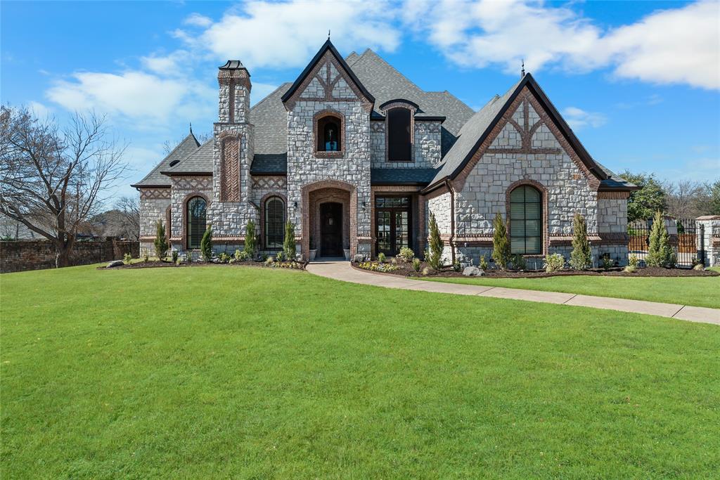Situated within the exclusive gated community of Rockrimmon, 4900 Rockrimmon Court presents a rare opportunity to own a custom estate on approximately 0.677 acres in the heart of Colleyville. Offering 5,791 square feet of refined living space, this residence blends timeless design, quality craftsmanship, and thoughtfully updated interiors throughout. Rich hardwood flooring, detailed millwork, soaring ceilings, and exposed wood beams create a warm yet sophisticated atmosphere from the moment you enter.Designed for both everyday living and entertaining, the main living areas flow seamlessly into an updated chef’s kitchen featuring upgraded cabinetry, premium finishes, expansive prep space, and views overlooking the resort-style backyard. The private primary suite serves as a true retreat with a spacious spa-inspired bath and oversized walk-in closet, while generously sized secondary bedrooms offer en suite baths and privacy for family and guests alike.Additional living spaces include a dedicated executive office, game room, media room, and a private cigar lounge, offering flexibility for work, entertainment, and relaxation. Step outside to an exceptional backyard experience complete with a heated pool, outdoor kitchen, large grassy yard, and rare private basketball and pickleball courts.Located in one of Colleyville’s premier gated neighborhoods and zoned to highly regarded GCISD schools, this property offers a combination of luxury, privacy, and convenience just minutes from Southlake, DFW International Airport, premier shopping, dining, and entertainment.
