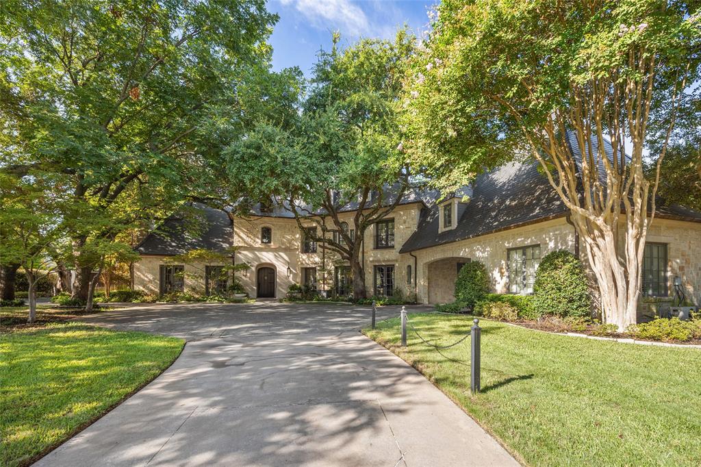 Located in the heart of Old Preston Hollow, this gated French-inspired estate sits on beautifully landscaped grounds just under an acre, offering privacy, scale, and timeless architecture. Originally built in 2002 and extensively renovated approximately ten years ago under the direction of renowned designer Gonzalo Bueno, the home blends classic design with refined, updated interiors. Spanning over 11,000 square feet, the residence features expansive living areas, a vaulted formal entry, private study, and a chef’s kitchen that opens to the family and keeping rooms—creating an ideal setting for both everyday living and large-scale entertaining. The first-floor primary suite offers a private retreat, with additional ensuite bedrooms, media room, and game room providing flexible living spaces throughout.The outdoor environment is designed for recreation and relaxation, featuring a resort-style pool, manicured grounds, and a newly added private pickleball court. A separate guest house, located across the pool, includes a bedroom, living area, and office—perfect for extended stays, work-from-home needs, or private accommodations. A gated motor court with four garage bays completes this exceptional offering.