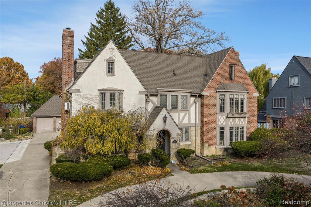 Timeless Tudor architecture and exceptional potential characterize this grand Palmer Woods residence. Located on a tree-lined street known for its beautiful homes, winding roads, and strong sense of community, this property offers excellent bones and the chance to create a truly spectacular retreat tailored for modern living and entertaining.A welcoming foyer leads to a spacious living room with a fireplace, a large wood-paneled library, and a generous screened porch that encourages indoor-outdoor living. Classic details throughout include rich millwork, leaded-glass accents, original plasterwork, and beautifully tiled vintage bathrooms. Four fireplaces add warmth and character, while the lower level features terrazzo floors and ample space for recreation, storage, or creative reimagining. With six bedrooms and three-and-a-half bathrooms, the layout offers flexibility for guest suites, working from home, or a thoughtful redesign. Its size, craftsmanship, and preserved architectural features present a rare opportunity to restore and personalize a Tudor of this caliber in one of Detroit’s most admired neighborhoods. Palmer Woods provides private security and road snow removal through its Special Assessment District. Convenient to Downtown Detroit, Ferndale, Birmingham, Palmer Park, the Detroit Golf Club, and the vibrant Livernois commercial district. This home qualifies for the NEZ-H property tax abatement.