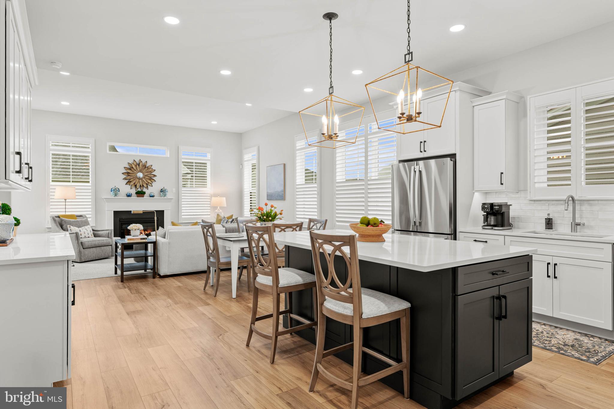 Searching for a high-end, custom, one-of-a-kind carriage home in a premier 55+ community? Your wait is over! Welcome to 650 Appaloosa Road, a truly exceptional, one-year-young McKee Builders Shannon model in the highly desirable Preserve at Marsh Creek.While buying new construction often means accepting basic builder grades or waiting months for completion, this home offers the ultimate advantage: the current owners have already invested heavily in premium, post-purchase custom upgrades. You get the flawless feel of a brand-new build, enhanced by thousands of dollars in high-end, aftermarket value from day one.From the moment you arrive, the charming covered front porch leads you into a dramatic two-story foyer filled with natural light. Step inside and fall in love with premium, homeowner-added designer finishes that elevate this home far beyond standard builder models: luxury vinyl flooring and custom lighting throughout, sleek black interior hardware and an upgraded ebony-stained staircase with black metal spindles and a custom runner, elegant custom plantation shutters on every window, offering immediate privacy and timeless style, and a first-floor powder room enhanced with sophisticated custom woodwork.The heart of the home is a spectacular kitchen thoughtfully curated with contrasting Dove White perimeter cabinetry and an upgraded island. It features striking Calacatta Gold Silestone countertops and a top-tier appliance package: a 30” Wolf Professional gas cooktop, a GE Profile combination wall oven/microwave, and a Bosch 800 Series dishwasher.The Custom Value-Add: The owners completely transformed this entertaining hub by adding a custom dry bar/coffee station complete with wine storage, glass-front cabinetry, and under-cabinet lighting—a premium upgrade you won't find in standard layouts.The open-concept layout flows effortlessly into a sun-filled breakfast area and an inviting great room centered around a cozy gas fireplace. A glass door opens to a spacious rear deck, perfect for grilling or peaceful morning coffee.The main-floor primary suite is a luxurious retreat featuring an upgraded en-suite bath with a double vanity, Silestone countertop, frameless shower door, and designer tile. Value Highlight: The owners completely customized the generous walk-in closets with premium built-in organization systems.Upstairs, a bright loft area boasts a custom built-in office—ideal for a library, study, or workspace—alongside a spacious family/TV room. Two guest bedrooms feature custom built-in closets, with one bedroom enjoying exclusive access to a private upper deck.The finished walk-out lower level truly sets this property apart. This expansive, bright space offers endless possibilities for a media room, home gym, or hobby space. It includes a sophisticated powder room, sizeable storage and workstation area, and sliding glass doors that open to a private, homeowner-installed travertine patio, seamlessly extending your living space outdoors.Skip the hassle of post-closing installations. The owners have already equipped this home with a whole-house gas generator with an automatic transfer switch and a a fully wired security system, giving you complete peace of mind when traveling.Enjoy low-maintenance living and the outstanding amenities of the Preserve at Marsh Creek, including a clubhouse, fitness center, swimming pool, pickleball courts, walking trails, and a community herb garden. Conveniently located near Marsh Creek State Park, shopping, dining, and major roadways, this home offers the perfect combination of luxury, comfort, and immediate, upgraded value.Don't wait for a builder—your turn-key masterpiece is ready today.