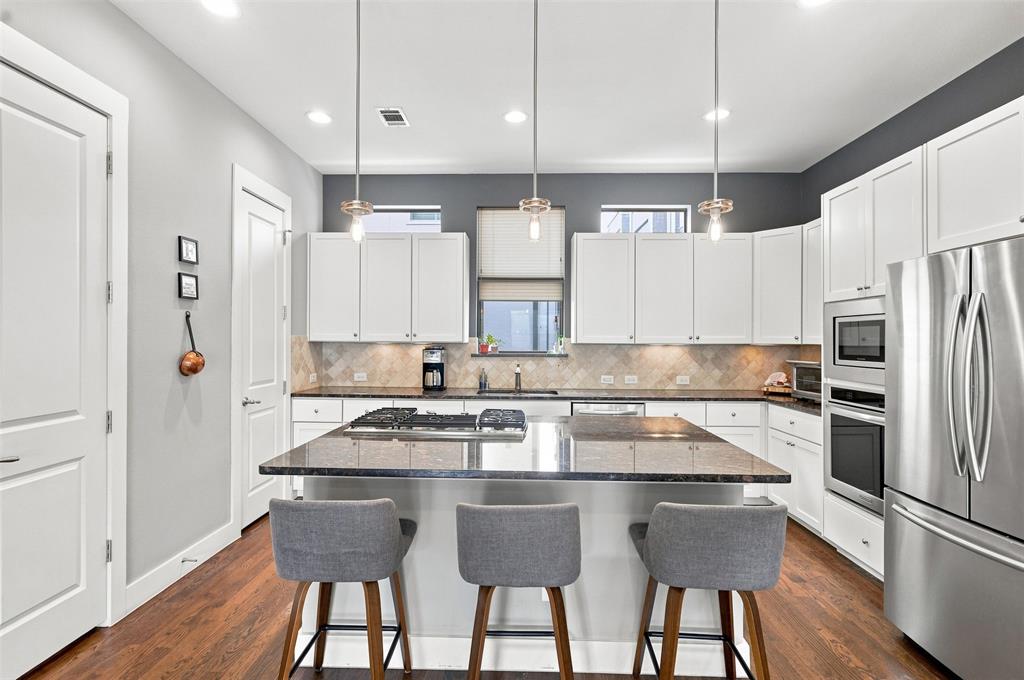 Urban Living Meets Southside Charm at Oleander Place Townhomes!  Enjoy walkable access to Magnolia Avenue and everything the Southside has to offer, along with TCU's medical school located directly across the street. Grab your morning coffee at Avoca, treat yourself to Melt Ice Creams, enjoy dinner at Cane Rosso or Nonna Tata, or catch a bite at Ellerbe. Add in the community events that make this stretch of the Southside so special, and you have a walkable lifestyle that's hard to beat.This 3 story townhome features a 400 sq.ft. rooftop deck with an outdoor living area and amazing views of downtown, ideal for relaxing evenings or entertaining.The first floor offers a bedroom with an ensuite bath, perfect as a guest suite, home office or flex space. Upstairs you'll find authentic hardwood flooring, oversized windows, solid slab granite countertops throughout. The chef's kitchen comes complete with a gas cooktop, and 10' ceilings in the living, dining and kitchen areas give the whole space an open, elevated feel.A 2 car rear attached garage with taller ceilings and a whole home surge protector rounds it out, and there's so much more to see in person.If you're looking for walkable urban living and the best of the Near Southside, this one is worth a look!