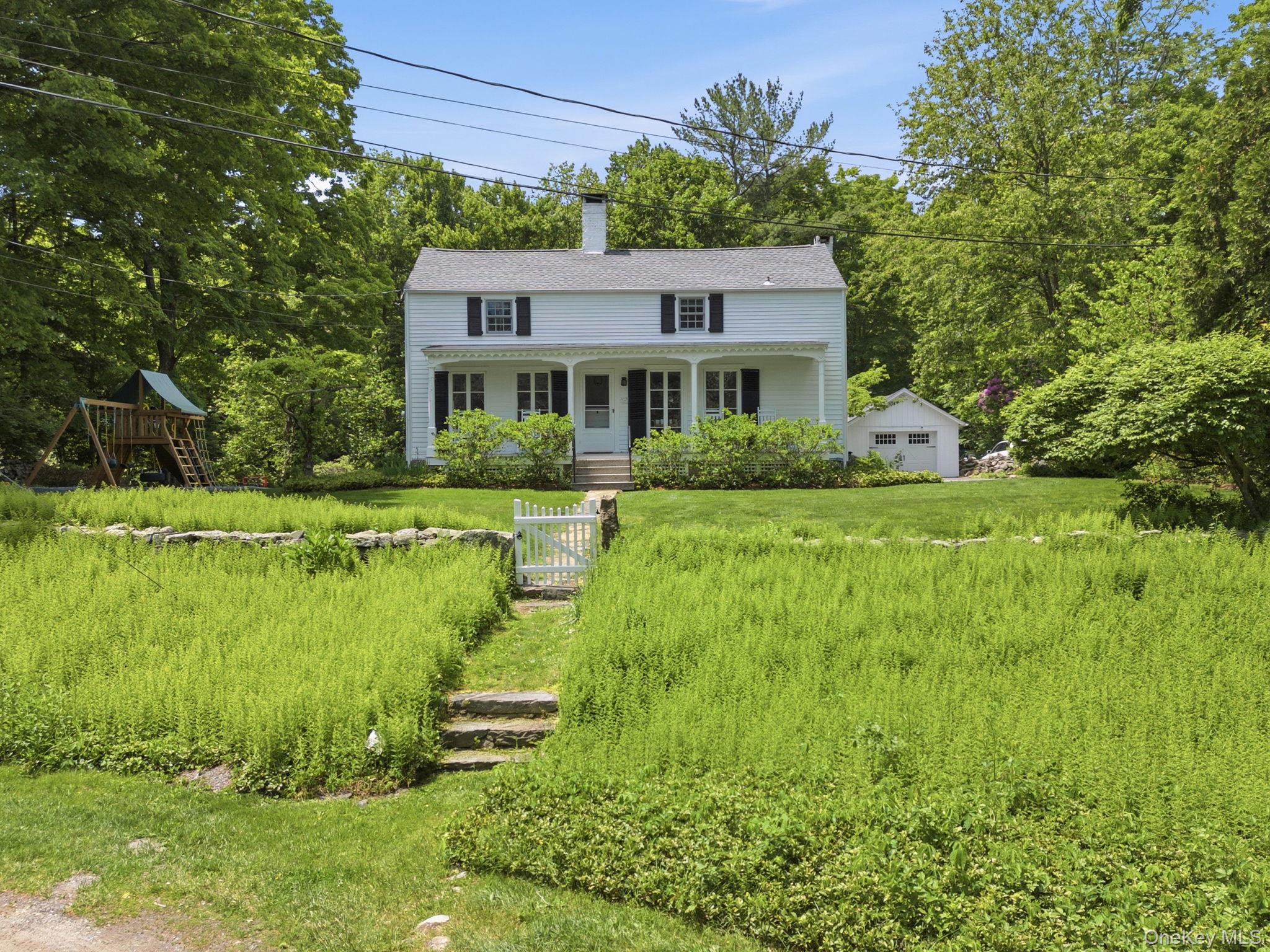 Experience the character of the historic Partridge Thatcher House (c.1788), thoughtfully updated for today's lifestyle. This well-maintained home offers a flexible floor plan with a sun filled living room with fireplace, dining room with original fireplace and pizza oven, along with a first-floor guest suite. The renovated kitchen (2020) features stainless steel appliances, granite countertops, and opens seamlessly to the main living spaces. The second floor includes 2 additional bedrooms, an updated bath, and office space.  Recent improvements include full house generator (2021), interior painting (2026), washer & dryer (2024), hot water tank (2023), brass plumbing piping (2021), and invisible dog fence. Outdoor amenities include a recently expanded driveway for ease of parking, detached 1 car garage with loft, expansive yard with pond views, and welcoming porch and patio spaces for relaxing or entertaining.  A rare opportunity to own a restored historic property that combines timeless charm with modern comfort and functionality right in the center of town. Less than half mile to Pound Ridge Elementary School, Pound Ridge Library, & Renowned Inn at Pound Ridge Restaurant.