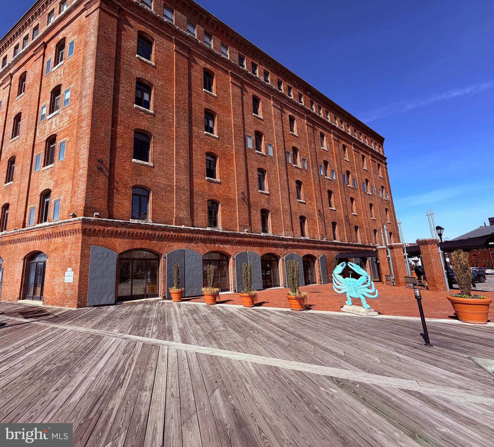 Location. Lifestyle. Waterfront Living.Welcome home to this charming two-story condominium in the heart of Historic Fells Point, ideally situated along Baltimore’s waterfront. Located within the iconic Inn at Henderson’s Wharf, this unique residence blends historic character with the comfort and convenience of upscale, hotel-style amenities.Overlooking a beautifully landscaped private courtyard, this former tobacco warehouse offers a peaceful harbor-side retreat while placing you just steps from one of Baltimore’s most vibrant neighborhoods.This inviting 1-bedroom, 1-bath condo features a distinctive two-story, loft-style layout that adds character and charm to the living space. Residents enjoy access to desirable amenities, including a fitness center, a beautifully maintained courtyard, secure garage parking, and the ease of everyday living that feels like a staycation.Step outside and you’re moments from the Waterfront Promenade, an 8-mile brick walkway along the harbor, perfect for morning jogs, dog walks, or relaxing waterfront strolls. The location is also convenient to Johns Hopkins Hospital and Medical School, making it an excellent option for those seeking both lifestyle and accessibility.Fells Point’s acclaimed restaurants, shops, and nightlife are right outside your door, allowing you to enjoy the neighborhood to the fullest without ever needing a ride home. For the times you do want to drive, the home includes a deeded parking space, a rare and valuable feature in this historic waterfront community.Charm, convenience, and waterfront living—this is truly the perfect place to call home.