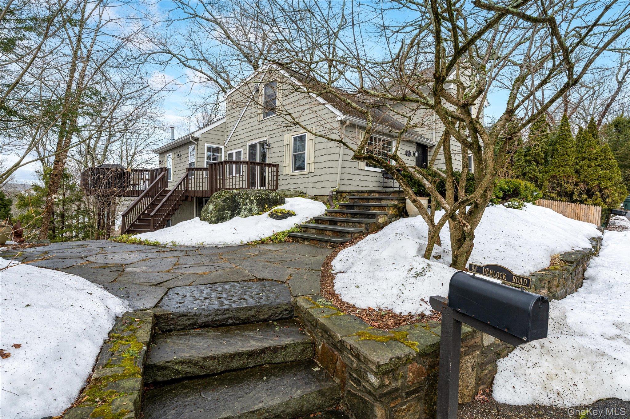 This incredible Cape Cod–style home features an expansive wraparound deck with seasonal panoramic lake views. The beautifully maintained residence showcases custom pine vaulted ceilings and exceptional woodwork throughout, creating a warm and inviting atmosphere.The home offers a five-zone heating system along with multi-zone air conditioning for year-round comfort and efficiency. The bedrooms are well-appointed and feature lighted ceiling fans, while the primary bedroom includes a desirable cedar closet.In addition to the inviting living spaces and well-appointed bathrooms, the lower level offers a gorgeous recreation room—perfect for entertaining or relaxing. The expansive driveway leads to a recently added 950-square-foot garage with loft space, complete with 50-amp electrical service.Impeccably maintained by the same family for over 30 years, this home offers character, comfort, and exceptional functionality.