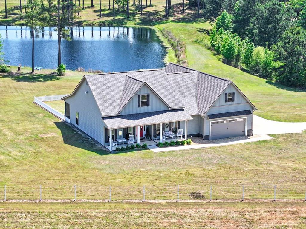 Bring your horses! Welcome to your own private retreat on nearly 10 acres, offering the perfect blend of modern comfort and peaceful country living. Built in 2020, this custom 3-bedroom, 3-bath home features 2,230 square feet and a thoughtfully designed open floor plan ideal for both everyday living and entertaining. Additionally, there's a bonus room with it's own private screened in porch that would be perfect for an office or 4th bedroom. The spacious back screened porch overlooking the pond is perfect for enjoying a good book or a drink of your choice in the evening. Enjoy access to a shared pond, adding to the property's scenic charm and outdoor appeal. For your sweet doggies there's a fenced in area behind the house just for them!   Equestrian enthusiasts will appreciate the well-equipped 3-stall barn, designed with both horse and owner in mind. Each stall features individual water plumbing, mounted fans, and a built-in misting system for optimal comfort. The barn also includes an interior wash rack, dedicated tack room, and hay storage area, along with a backup solar power system exclusively supporting barn operations—an uncommon and valuable feature. There's also a fully fenced pasture, making this property turnkey for your livestock.   Adding even more peace of mind, the property includes a transferable Choice Home Warranty in place through July 6, 2029. This extended coverage protects major systems and appliances, including the HVAC system, plumbing, septic system, washer and dryer, refrigerator, and microwave—a rare and valuable benefit for the next owner.  Conveniently located just 4 miles from downtown Cairo and only 20 minutes from downtown Thomasville, you get the best of privacy without sacrificing accessibility. With acreage, water access, equestrian-ready amenities, and long-term system protection already in place, this property stands out as a truly unique opportunity.