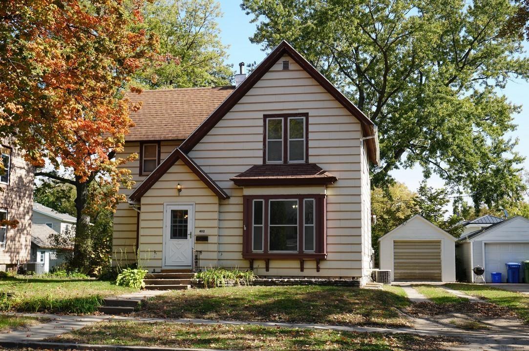 Ready for your personal touch! This spacious 2-story home offers 1,368 sq ft of living space with 2 bedrooms and full bath. Hardwood floors throughout. The generously sized living room features a picture window, while the formal dining room and efficient kitchen provide function for everyday living and give space to entertain. Two large bedrooms and a full bath are upstairs. The basement offers laundry hookups and additional storage. Outside, enjoy a nice backyard with a patio area and mature trees. A detached single-car garage is just outside the back door. Ideally located near recreation, schools, and the business district, this home offers an opportunity to make it your own!