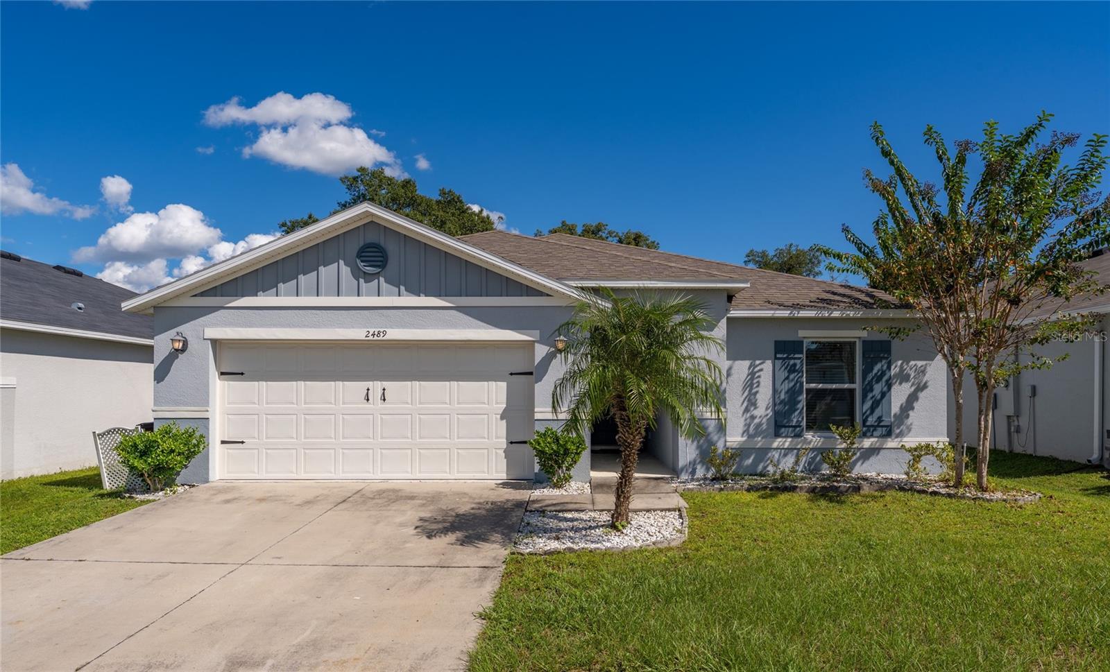 Virtually Staged. **Welcome to your new home in the heart of St. Cloud, Florida!** This beautiful single-story home offers 4 bedrooms, 2 bathrooms, and a spacious 2-car garage, combining comfort, functionality, and modern style. Step inside to discover a bright and inviting open-concept layout that seamlessly connects the living, dining, and kitchen areas, creating the perfect setting for everyday living and entertaining. The kitchen features elegant granite countertops, stainless steel appliances, ample cabinetry, and a spacious center island with breakfast bar seating. The primary bedroom offers a comfortable retreat with a walk-in closet and private bathroom. Three additional bedrooms provide flexible space for guests, a home office, or other needs. Additional features include a water heater, neutral interior finishes, and a spacious backyard with plenty of room for outdoor activities, entertaining, or simply enjoying Florida's beautiful weather. **Conveniently located in the desirable city of St. Cloud**, this home offers easy access to US Highway 192, providing convenient connections to shopping, dining, entertainment, and everyday essentials. Don't miss the opportunity to make this wonderful property your new home. Schedule your private showing today!