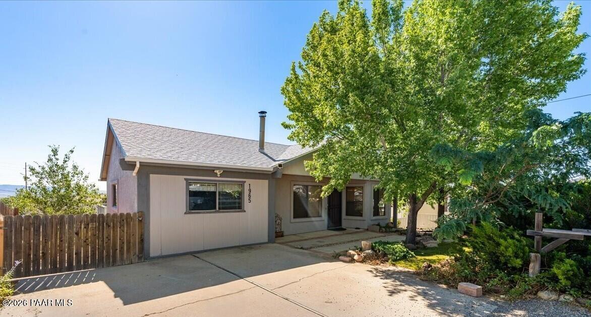 FIRST TIME ON THE MARKET! This lovingly maintained home features 2,434 square feet of comfortable living !The main level offers vaulted ceilings, 3 bedrooms, 2 bathrooms, and convenient main-level living. Downstairs, you'll find an additional 1 large bedroom and 1 bathroom, along with a spacious entertainment area perfect for guests, multi-generational living, or a recreation room.Situated on a beautifully landscaped 0.24-acre lot, the property boasts a fully (double) fenced backyard, providing privacy, space for pets or gardening, and plenty of room to enjoy the outdoors. Relax on the wrap around deck and take in the views from a home that combines comfort, functionality, and charm.     A heated and cooled enclosed carport offers incredible bonus space with endless possibilities--home office, gym, studio, workshop, or hobby room.Enjoy peace of mind with major updates completed in 2013, including the roof, windows, stucco, and HVAC system.This property offers privacy, room to roam, and the opportunity to update and make it truly your own.  This one is worth seeing!!