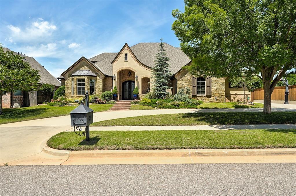 This luxurious West Norman custom home is a true 5 bedroom, 4 1/2 bath, with 3 of the bedrooms plus a study downstairs! The oversized backyard features a dreamy pool/spa, two covered patios for entertaining, an outdoor kitchen, and rarely found extensive amount of green space beyond the pool. The backyard also backs to a wooded area for the ultimate in privacy! The high-end kitchen features a built-in refrigerator/freezer, a new ice machine, new dishwasher, 48" gas range, a walk-in pantry, and an oversized island. This open concept plan is exceptional for entertaining with the kitchen overlooking both the spacious dining area, plus the extra large living room with vaulted ceilings and beautiful wood beams, tons of natural light, functional built-ins, and a gas fireplace. The oversized 5th bedroom upstairs could also be used as an optional game room. Add in that it is walkable to Roosevelt Elementary, has brand new carpet as of July 2025, true walnut nail down wood flooring throughout the main areas, a theater room, a side entry driveway plus a front circle driveway for additional parking, an in-ground storm shelter in the 3 car garage, and gorgeous curb appeal and landscaping... makes this home impossible to beat! Schedule your showing today!
