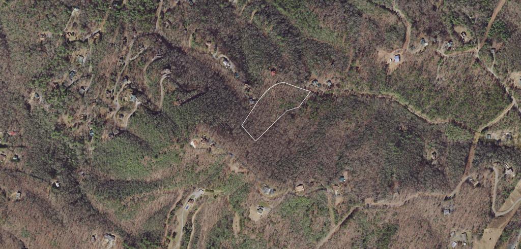 Mountain Lot in the Country while close to town(s).  Downtown Murphy 15 Minutes, Blairsville 20 Minutes, Mineral Bluff 20 Minutes.  This wooded Mountain Lot already has the Septic in place, making your building process that much easier. Excellent ingress and egress, power is nearby.