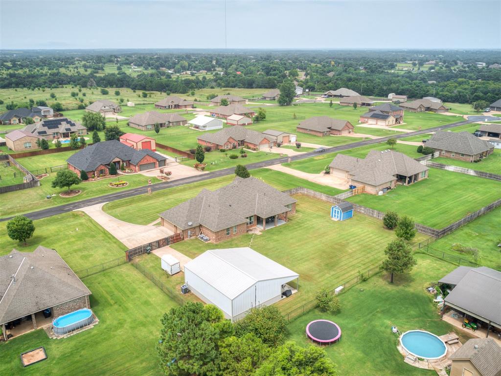 Looking for room to run, play, and live your best life? This is a gorgeous home sitting on a one acre lot in the Deer Creek School District. Wide open spaces, warm natural light, and a layout that lends itself to every day living or casual and formal entertaining. Tile and wood-look floors that are as easy to care for as they are pretty, fresh clean color palette throughout, and a great flow from room to room.

The entryway sets the tone with soaring ceilings, gorgeous tile floors, and chandelier lighting that says, “You’ve arrived.”

Kitchen Crush! Granite countertops, rich custom cabinetry, double ovens, and an island ready for holiday buffets, or midnight snacks. Tons of storage throughout,a walk In pantry, plus secondary pantry that is massive. The bright breakfast nook overlooks the backyard.

A spacious primary bedroom gives you plenty of room to stretch out and relax – with tray ceilings, NEW soft carpet underfoot, and natural light. The primary bath make mornings feel easy and evenings feel like a spa night. Double vanities mean no sharing space, and there’s loads of storage for all the things. The oversized walk-in shower is sleek with marble-style tile, and the soaking tub is just waiting for bubbles. Closet envy! With built-in shelving, tons of hanging space, and room for shoes, hats, bins, and bags, you’ll finally have a spot for everything.

30x40 Insulated Shop with Covered Patio is a dream setup for hobbyists, mechanics, or anyone needing extra workspace or storage. Fully insulated, zoned air conditioning and equipped with two overhead doors (including one oversized), it’s ready for your projects, tools, and toys. Concrete drive, electricity, and plenty of space to spread out.

With 4 bedrooms, 3 full baths, laundry with sink, folding counter and space for a fridge.  Mudroom entry off garage for dropping bags etc. New roof less than one year old.  MUST SEE for yourself - too many features to list !